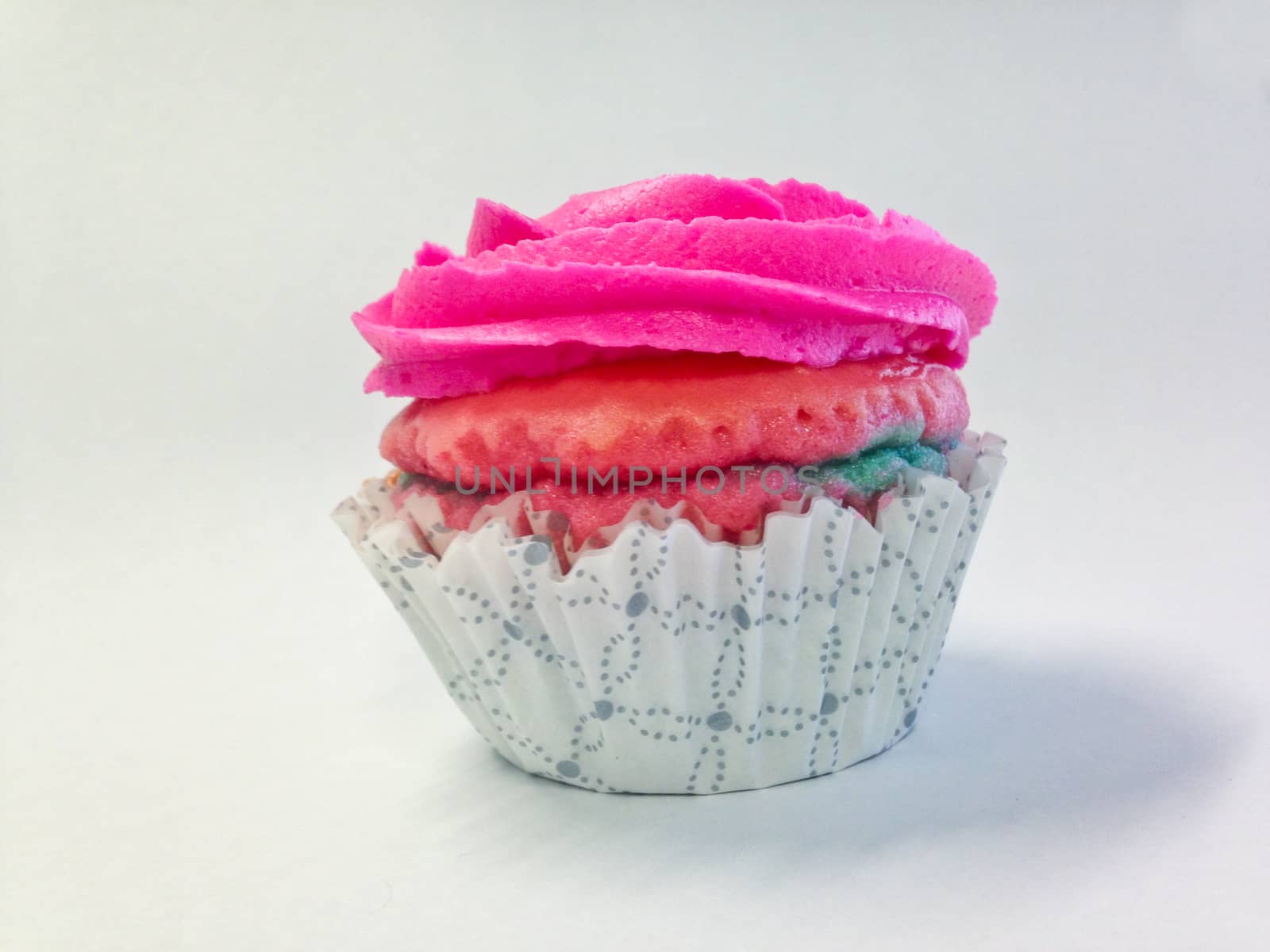 Sweet pink cup cake isolate side view by eyeofpaul