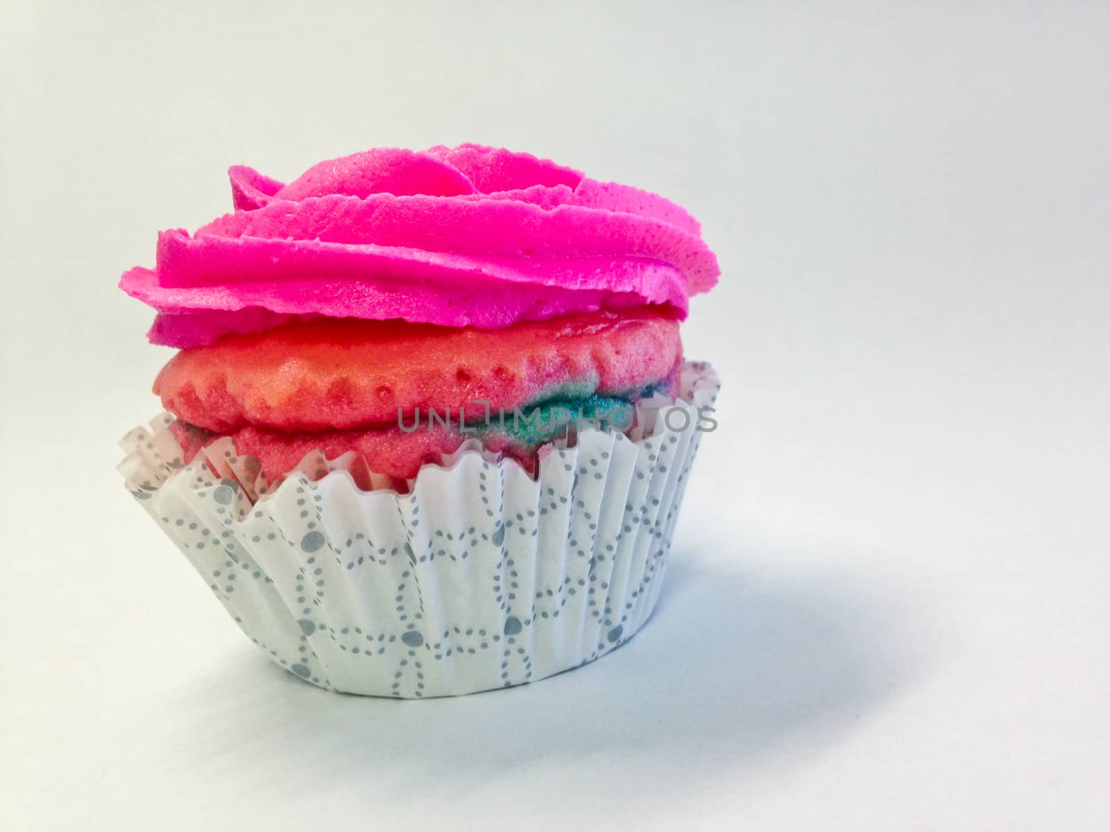 Pink yummy cup cake isolate side view by eyeofpaul