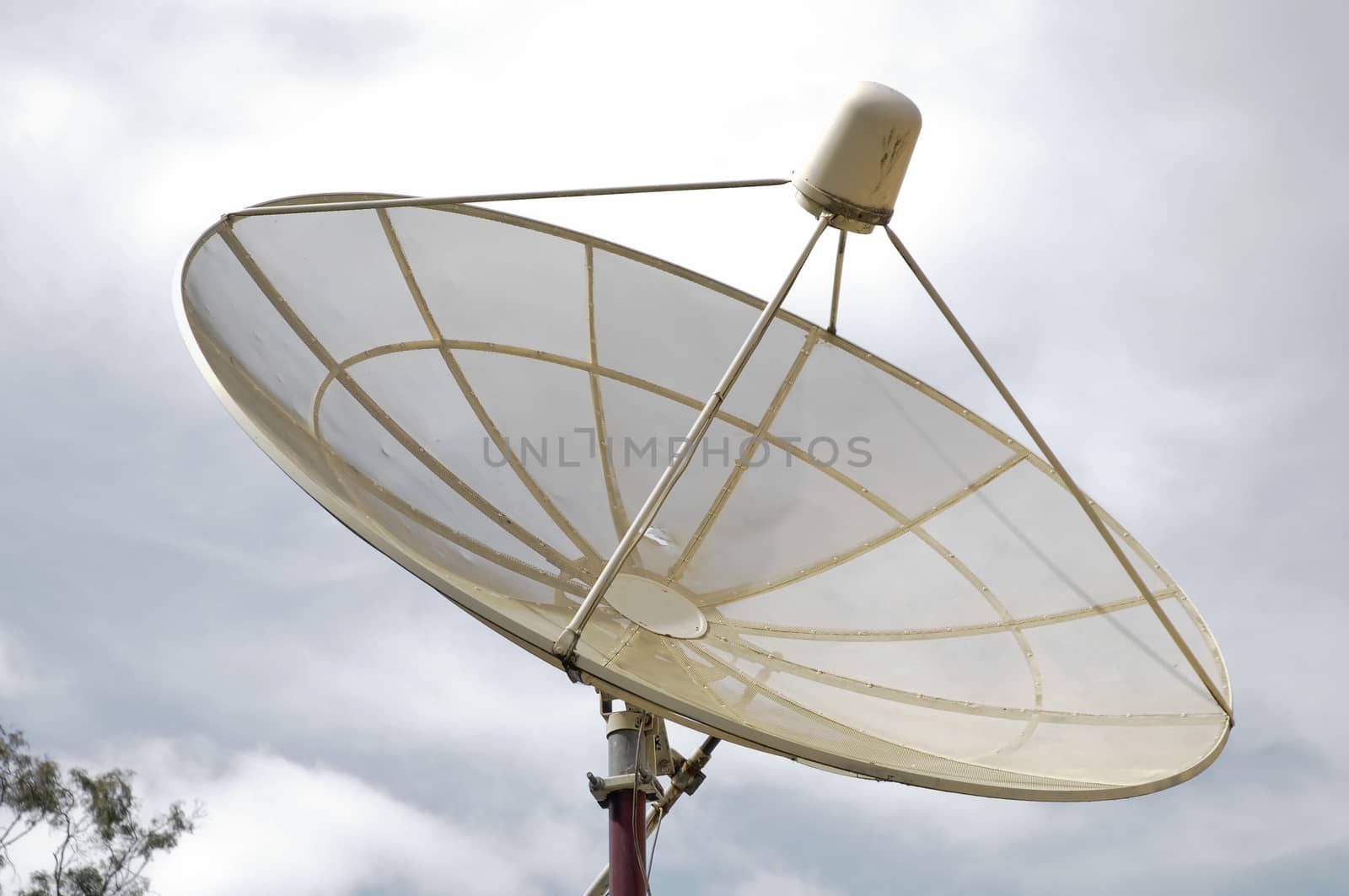 Modern satellite reception dish and cloudy sky by eyeofpaul