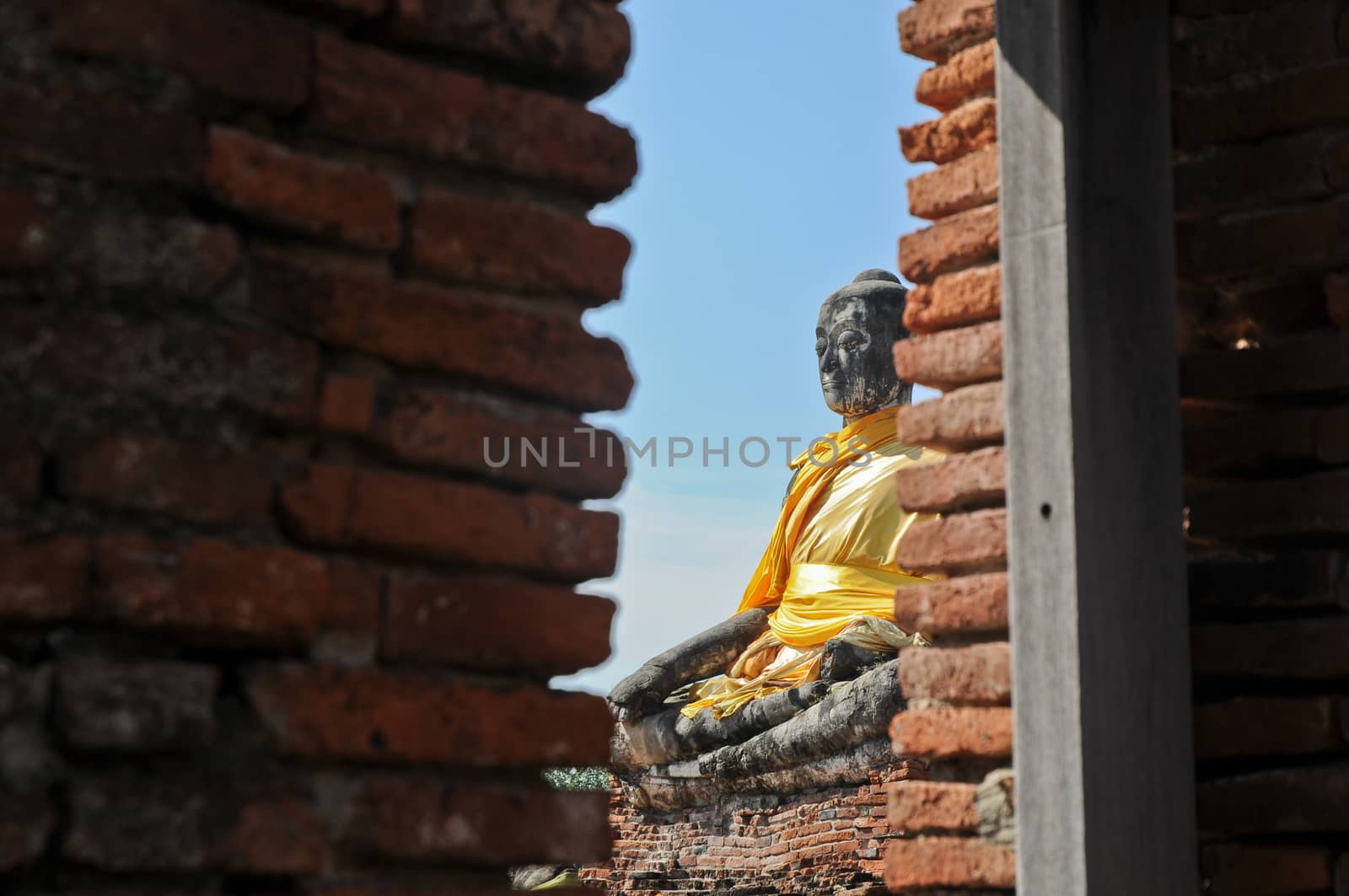 Window view to Ayudhaya Buddha statue Thailand