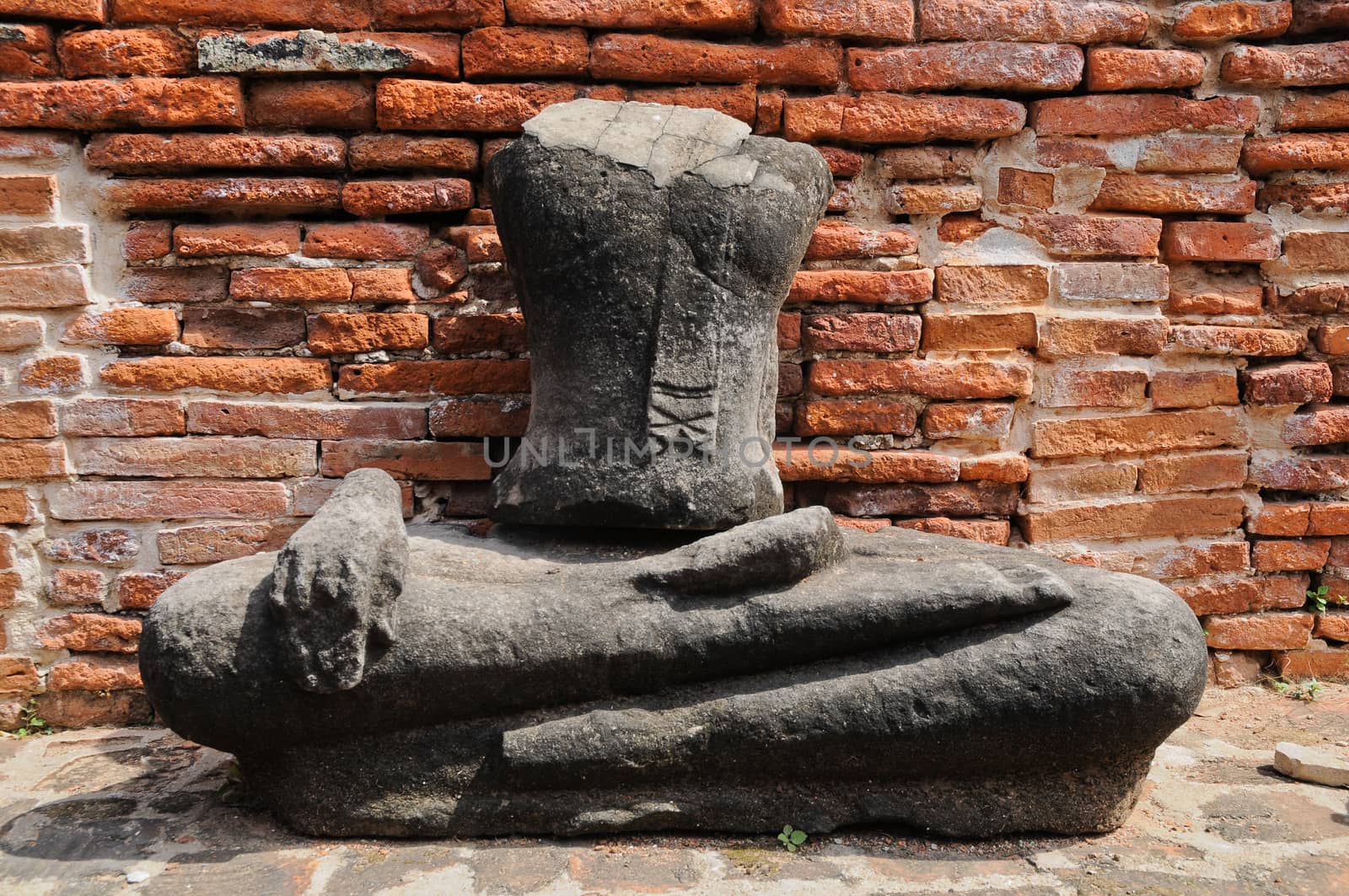 Sitting ancient Buddha statue in Thailand