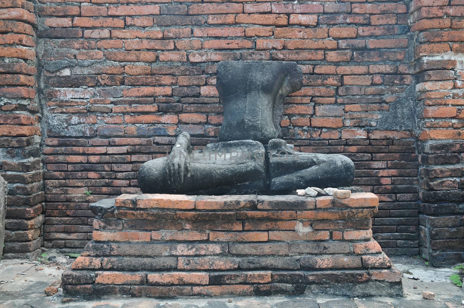 Ruin of Buddha ancient statue in Ayudhaya Thailand by eyeofpaul