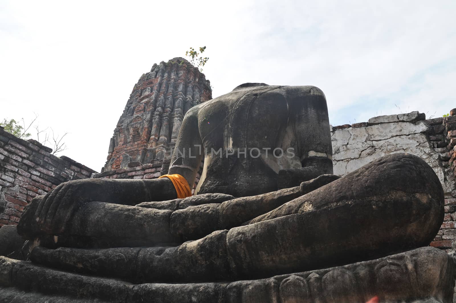 Look up on ancient Buddha statue in Ayudhaya Thailand by eyeofpaul