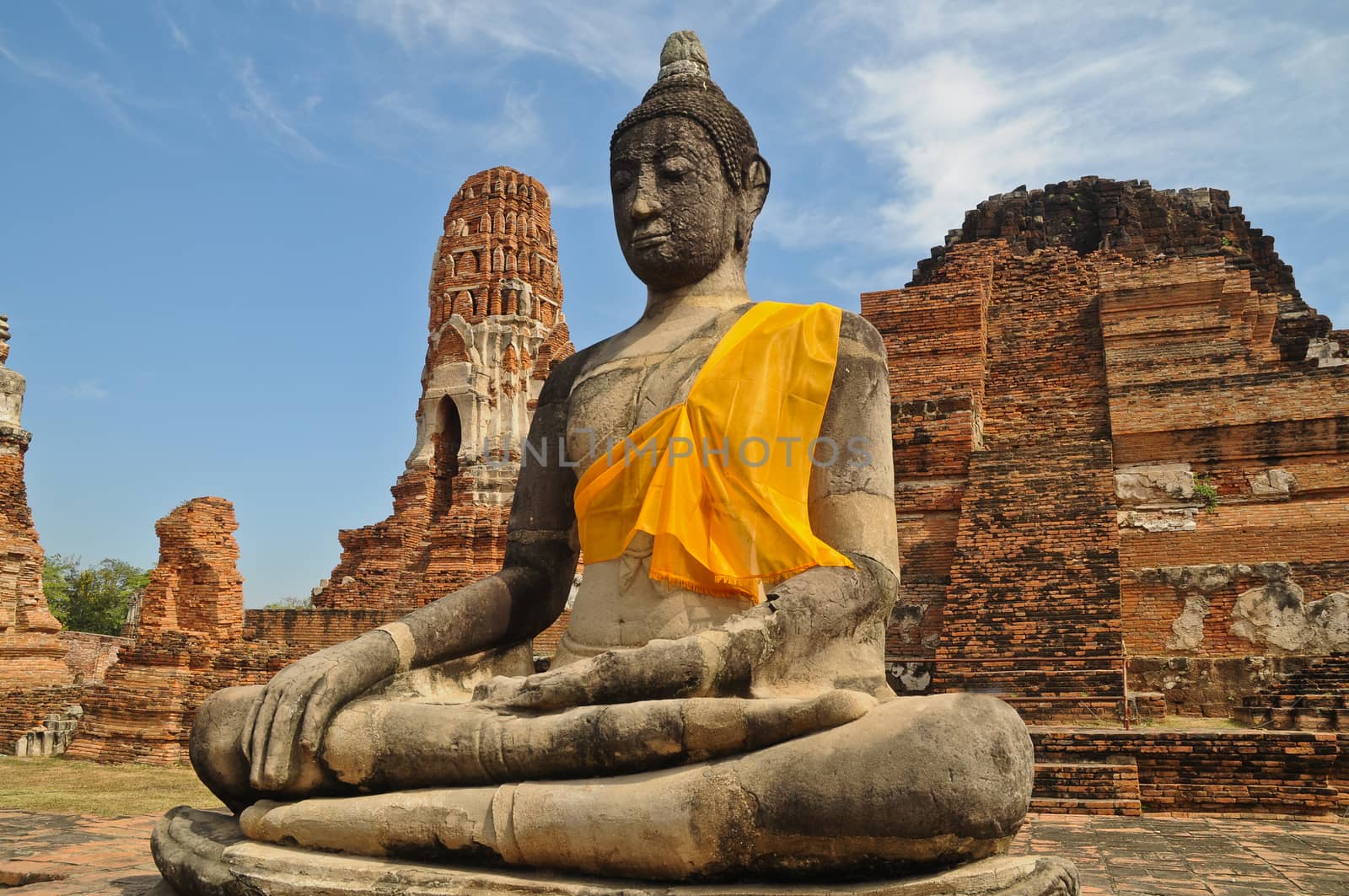 Buddha statue sit in Ayudhaya Thailand blue sky