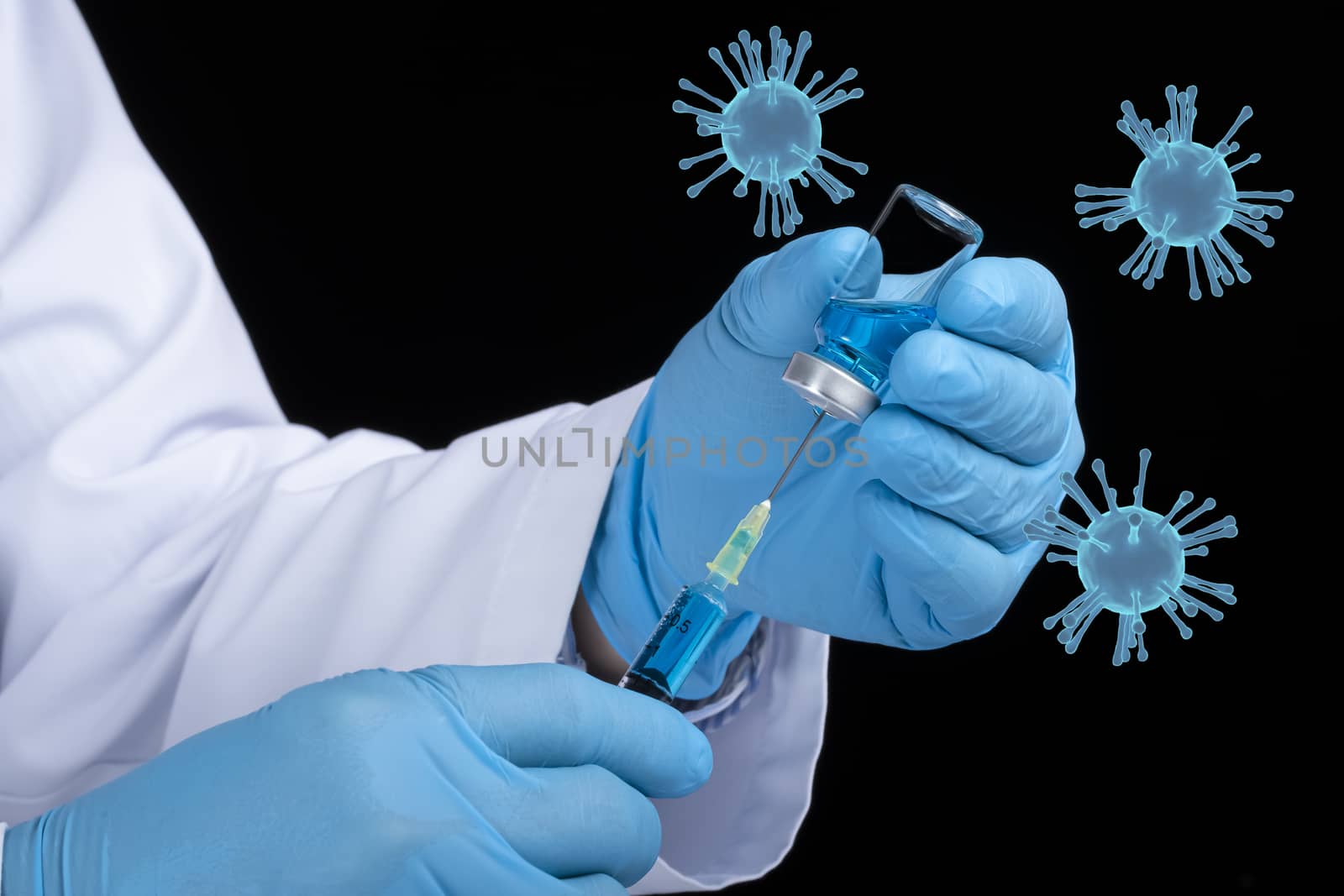 A doctor or a scientist drawing blue liquid from a glass vial. Covid-19 vaccine concept. Dark background with blue corona viruses.