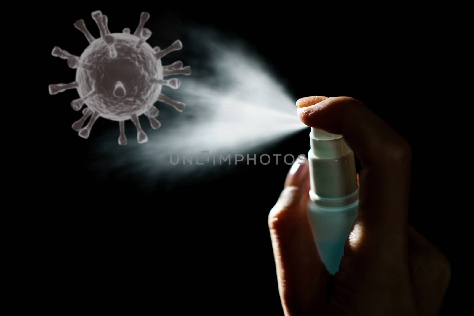 Hand using sanitizer spray, alcohol spraying disinfectant to stop spreading coronavirus or COVID-19.