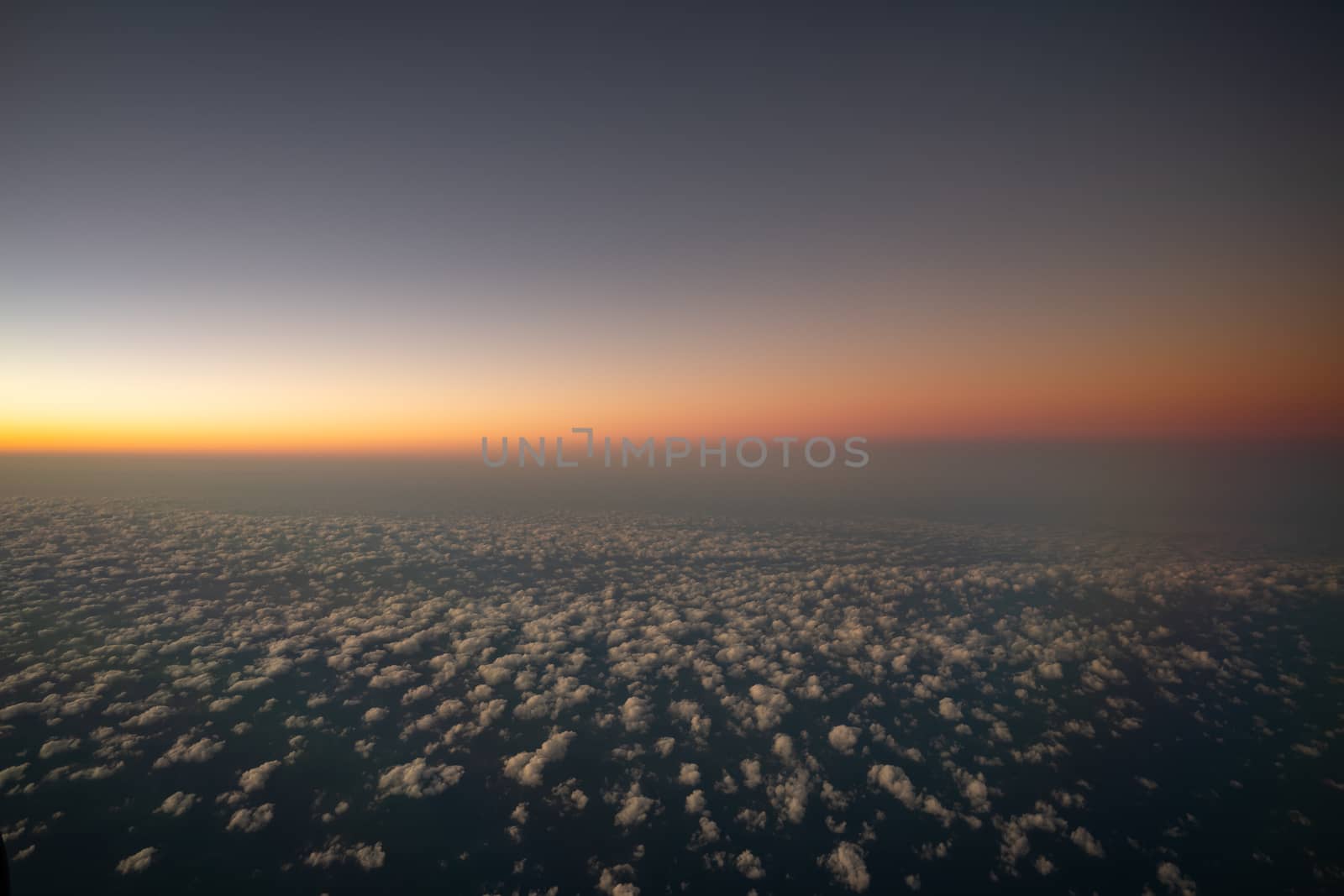 Evening twilight sky, horizon view from the window plane. by sirawit99