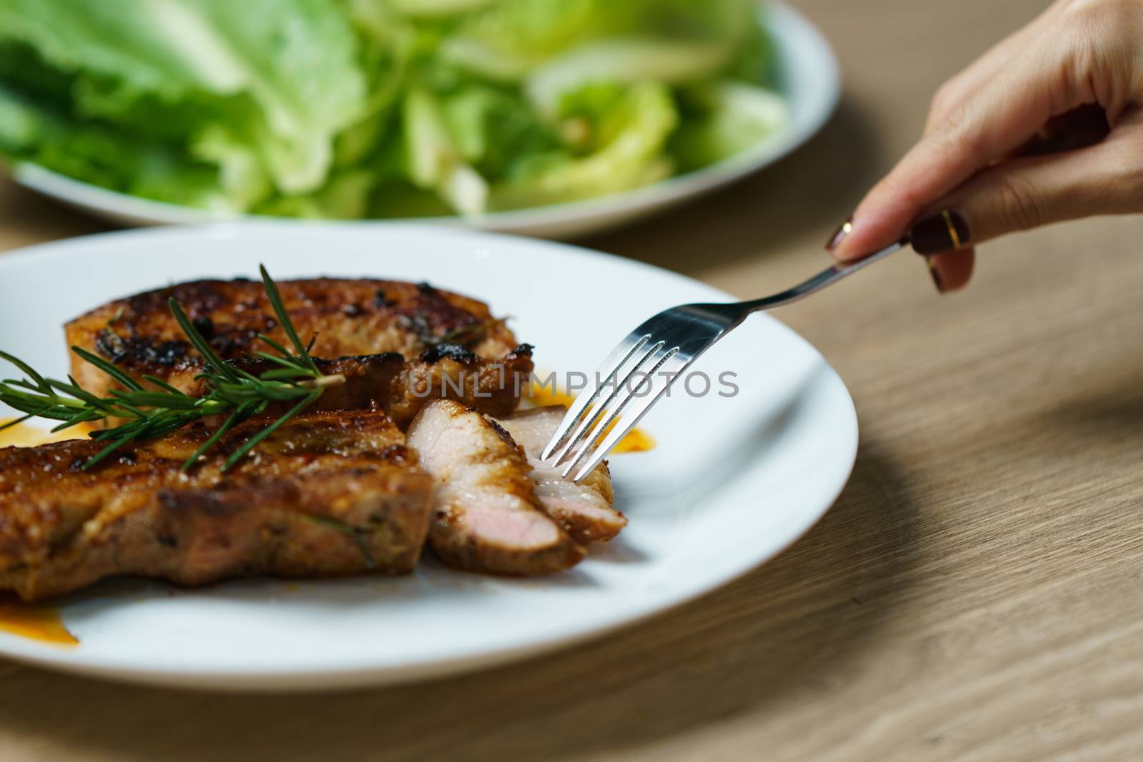 Pork juicy steak grill with vegetables and spices.