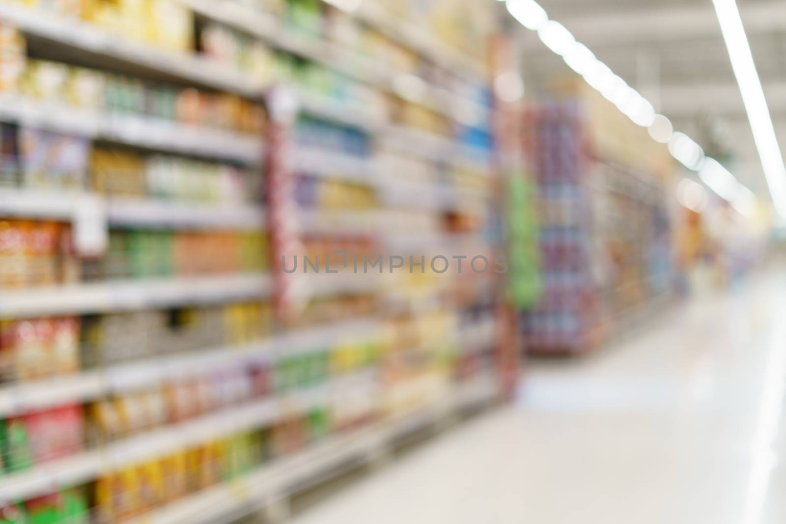 Supermarket blurred background fruit juice on shelves at grocery by sirawit99