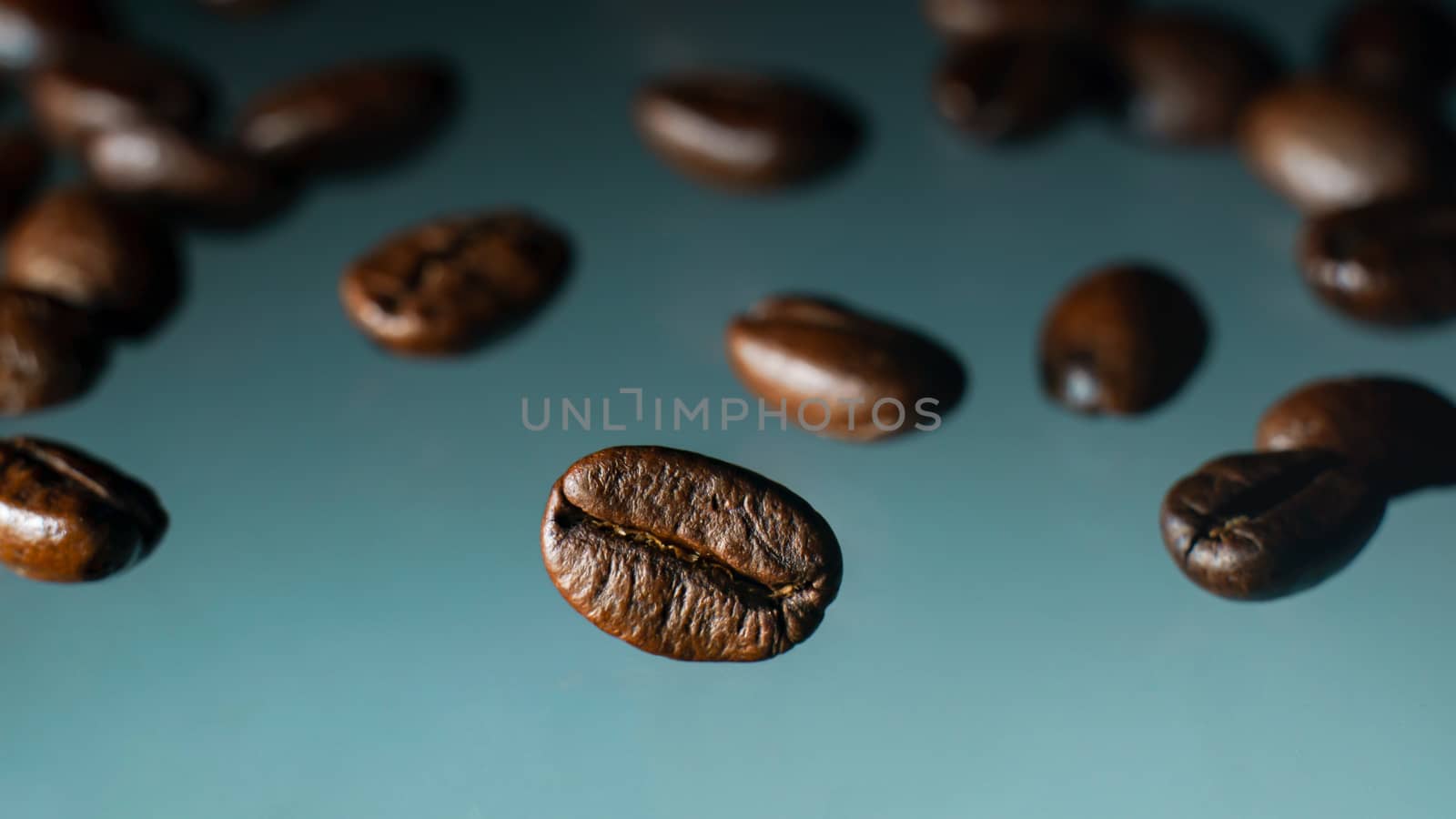 Roasted coffee beans pile on clear background.