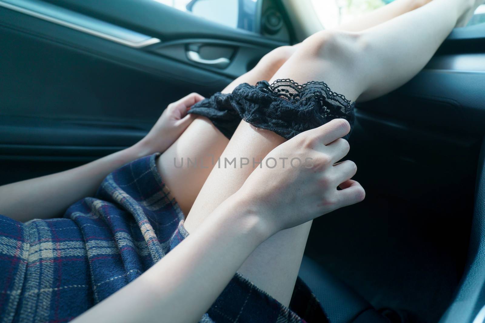 sex in car concept : woman take off her panty in a car. by sirawit99