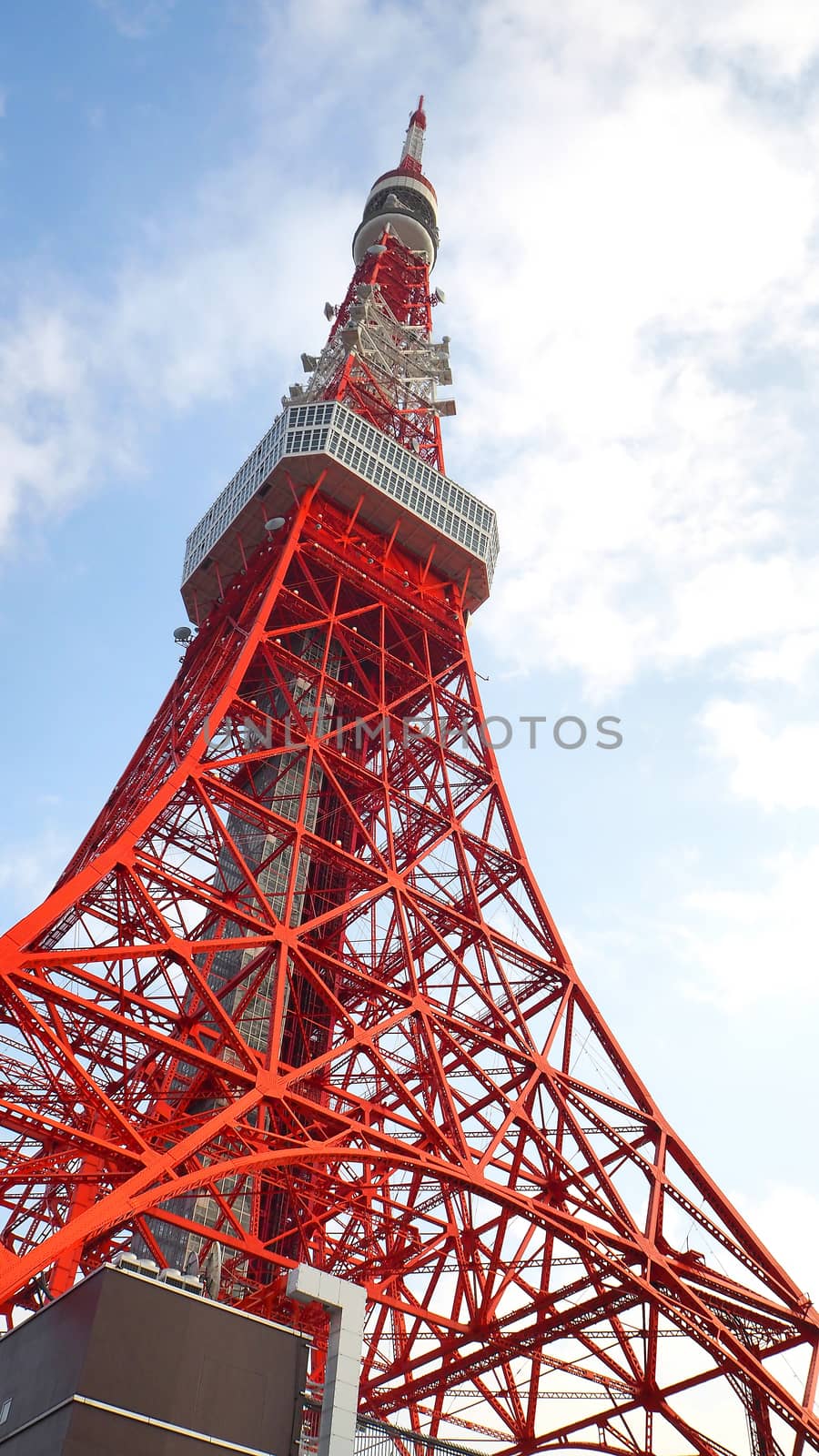 Tokyo tower red and white color steel metal and blue sky.