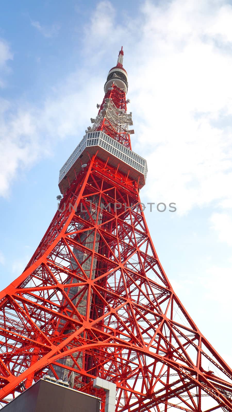 Tokyo tower red and white color steel metal and blue sky.