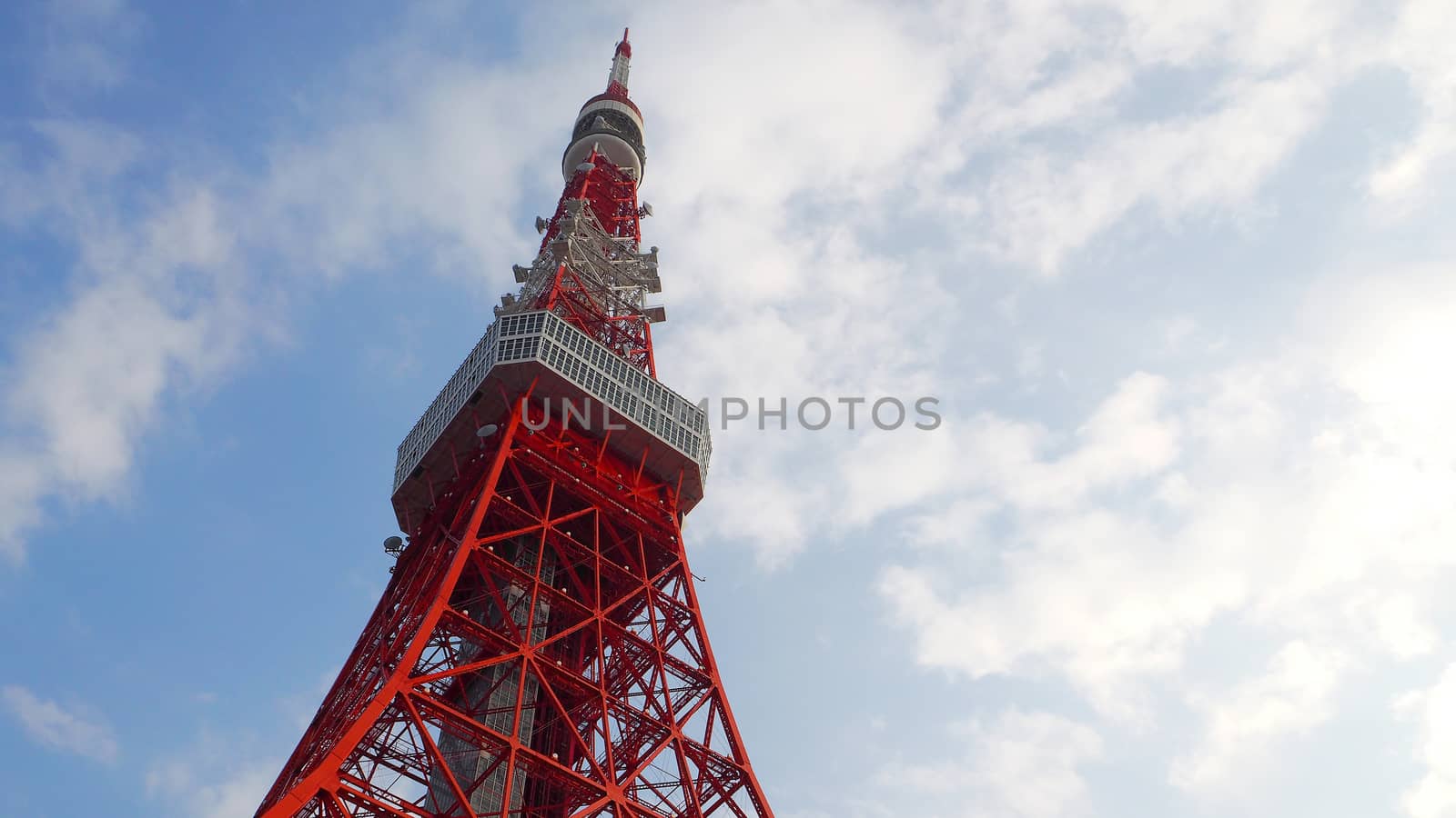 Tokyo tower red and white color steel metal and blue sky.