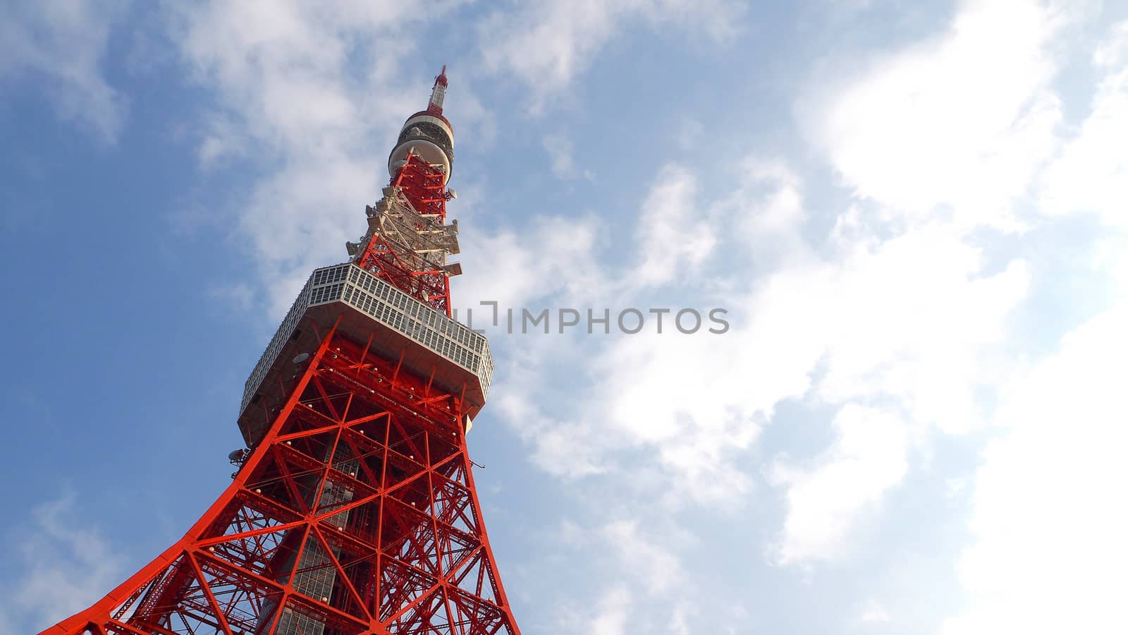 Tokyo tower red and white color steel metal and blue sky.