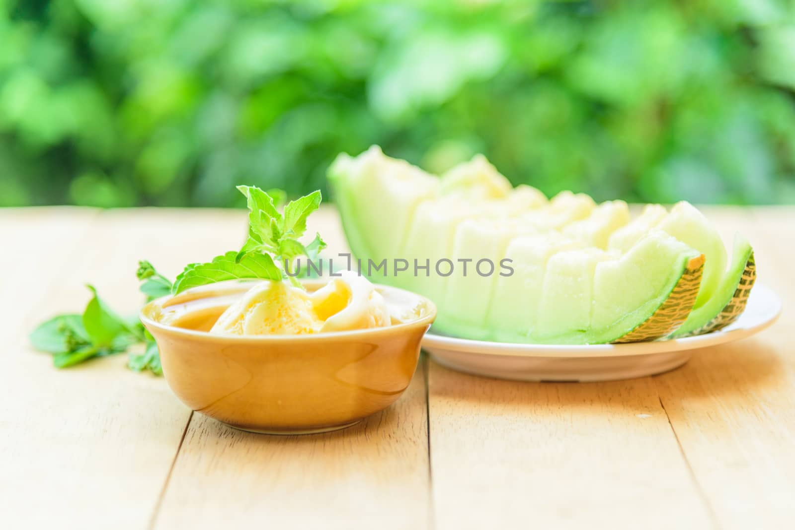 ice cream melon on wood table by rukawajung