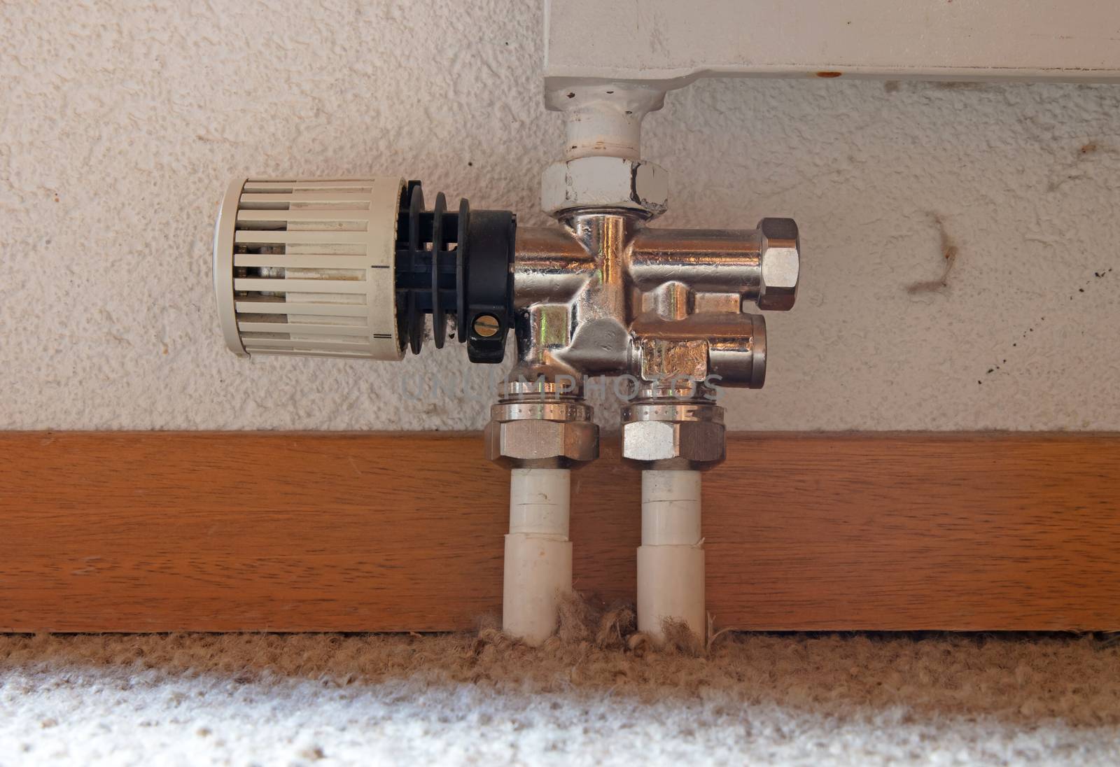 Heating radiator detail with adjusting knob by michaklootwijk