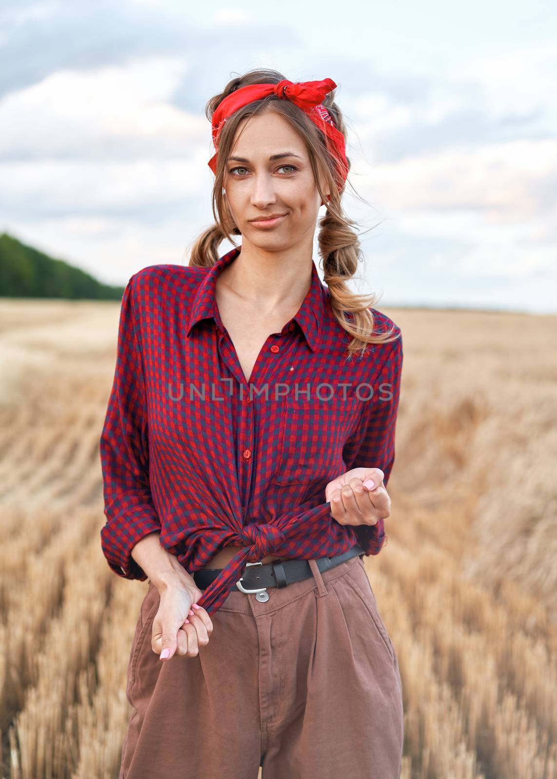 Woman farmer standing farmland smiling Female agronomist specialist farming agribusiness Happy positive caucasian worker agricultural field dressed red checkered shirt and bandana