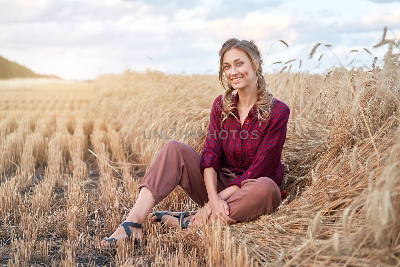 Woman farmer sitting farmland smiling Female agronomist specialist farming agribusiness Happy positive caucasian worker agricultural field dressed red checkered shirt and bandana Red plaid shirt.