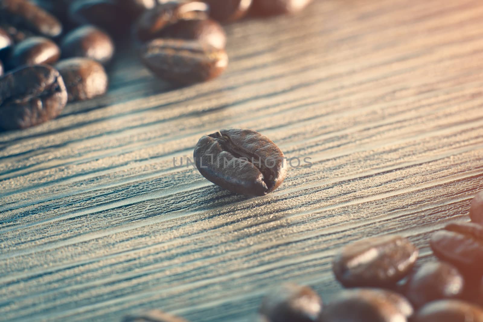 Coffee beans. On a wooden background. by sirawit99