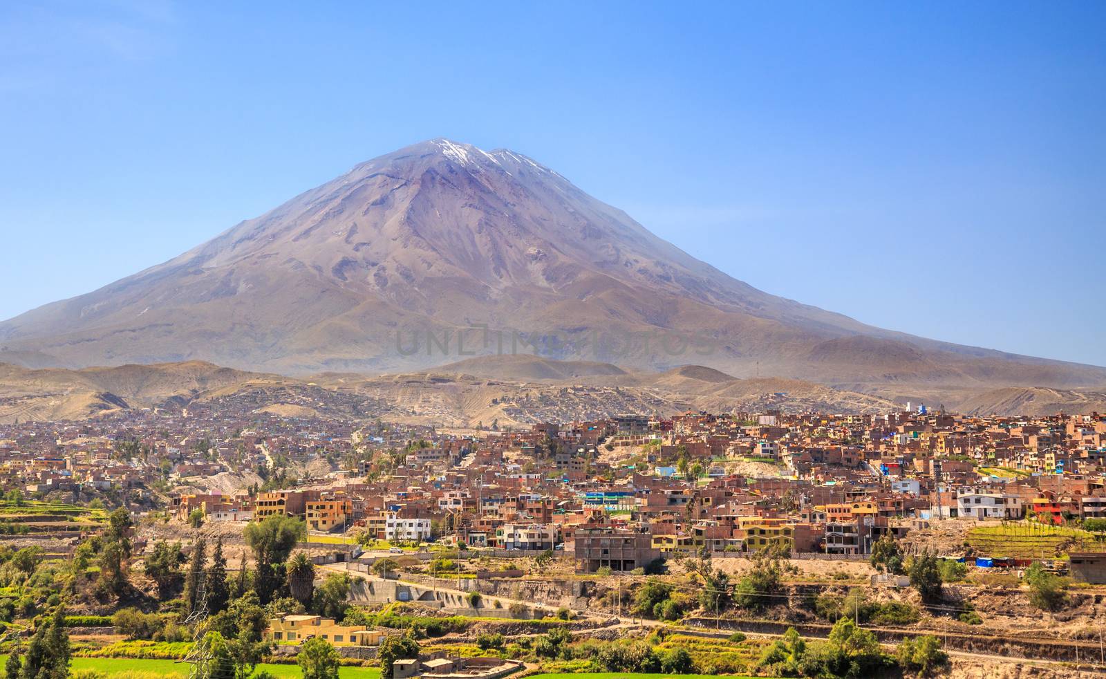 Dormant Misti Volcano over the streets and houses of peruvian ci by ambeon