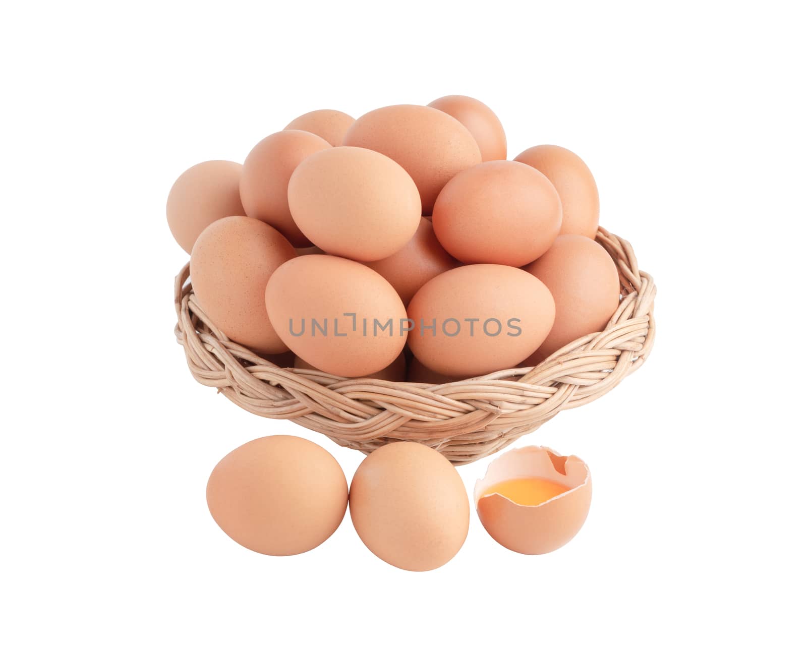 Chicken eggs in the wicker basket and one egg broken. Raw food isolated on the white background with clipping paths