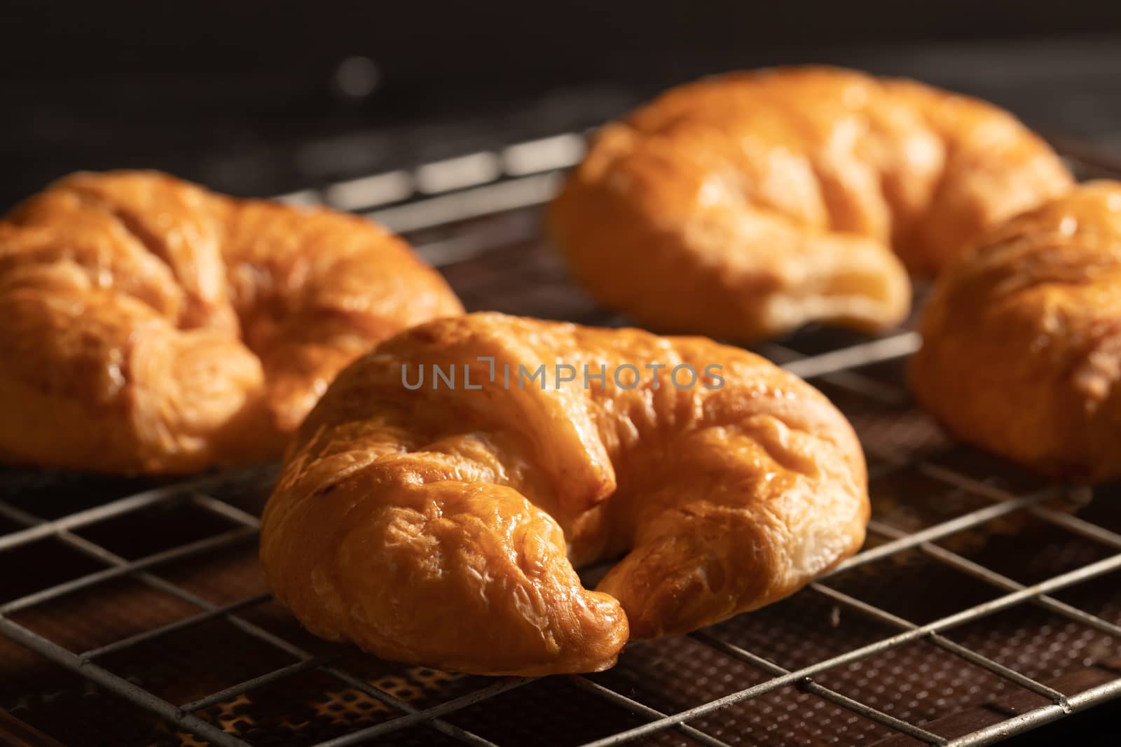 croissant on the grille in the oven by Nikkikii