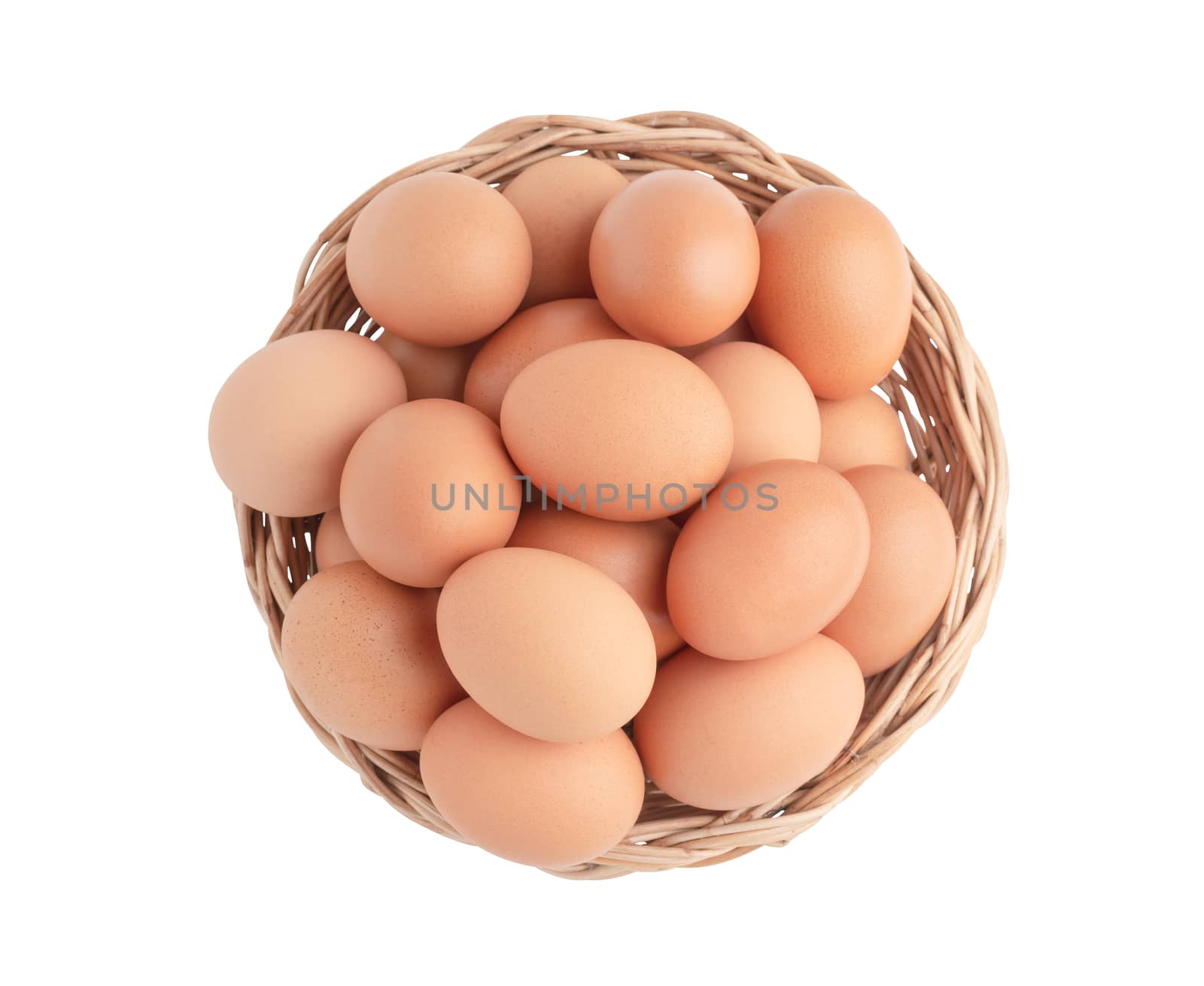 Top view chicken eggs in the wicker basket. Raw food isolated on the white background with clipping paths