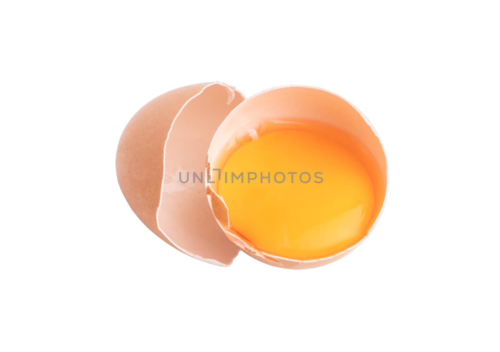 Egg yolks in a broken shell isolated on the white background with clipping paths