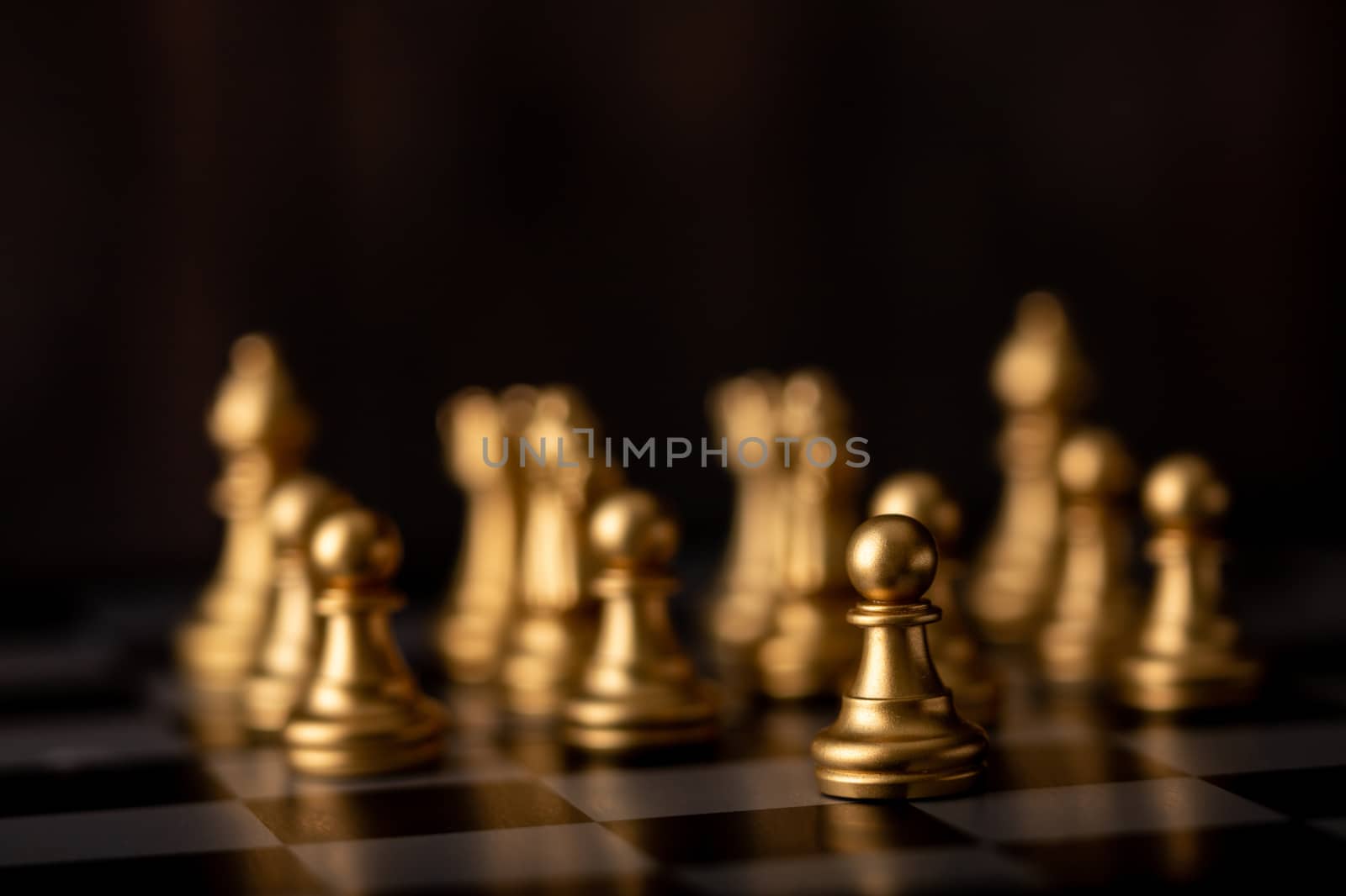 gold chessman on board in game by Nikkikii