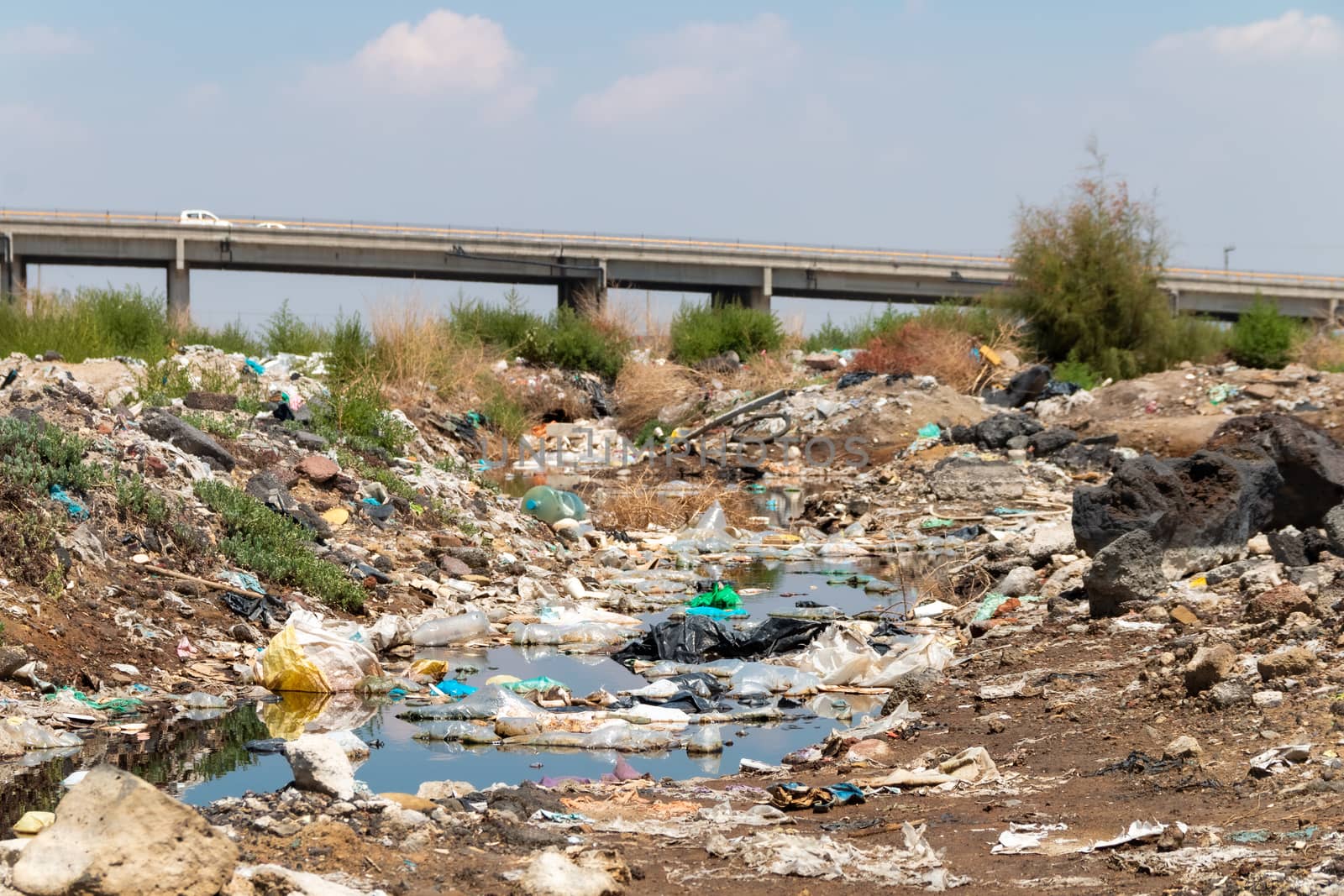 River polluted by plastic waste. Pollution concept. Recycling. by leo_de_la_garza