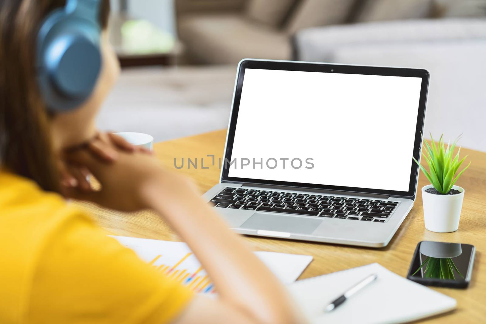 Back side of Asian business woman using laptop with white screen by Tzido