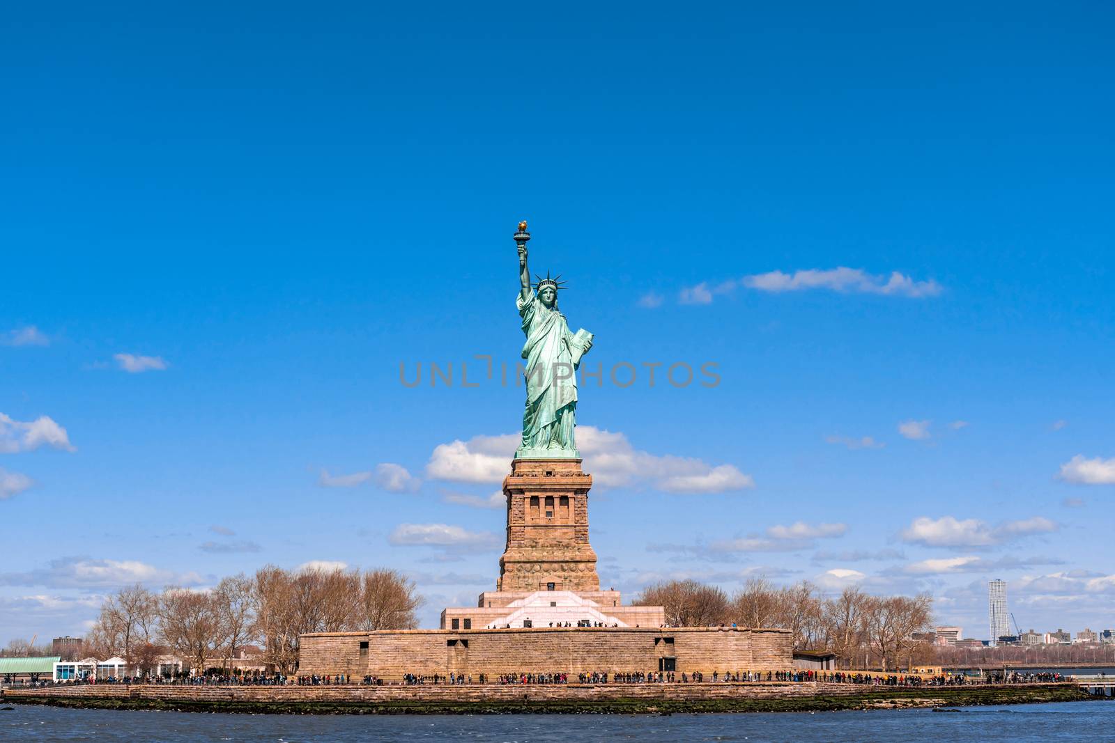 The Statue of Liberty under the blue sky background, Lower Manha by Tzido