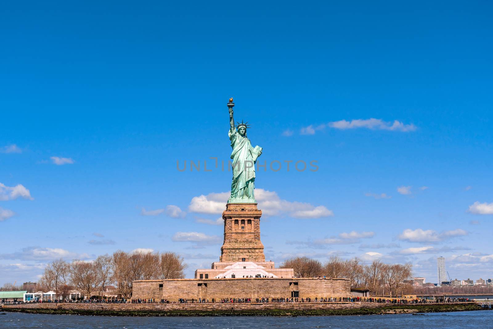 The Statue of Liberty under the blue sky background, Lower Manhattan, New York City, United state of America, Architecture and building with tourist concept