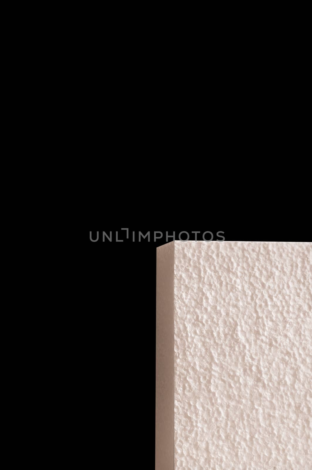 Abstract background with a light pink rectangular three-dimensional figure on a black background.