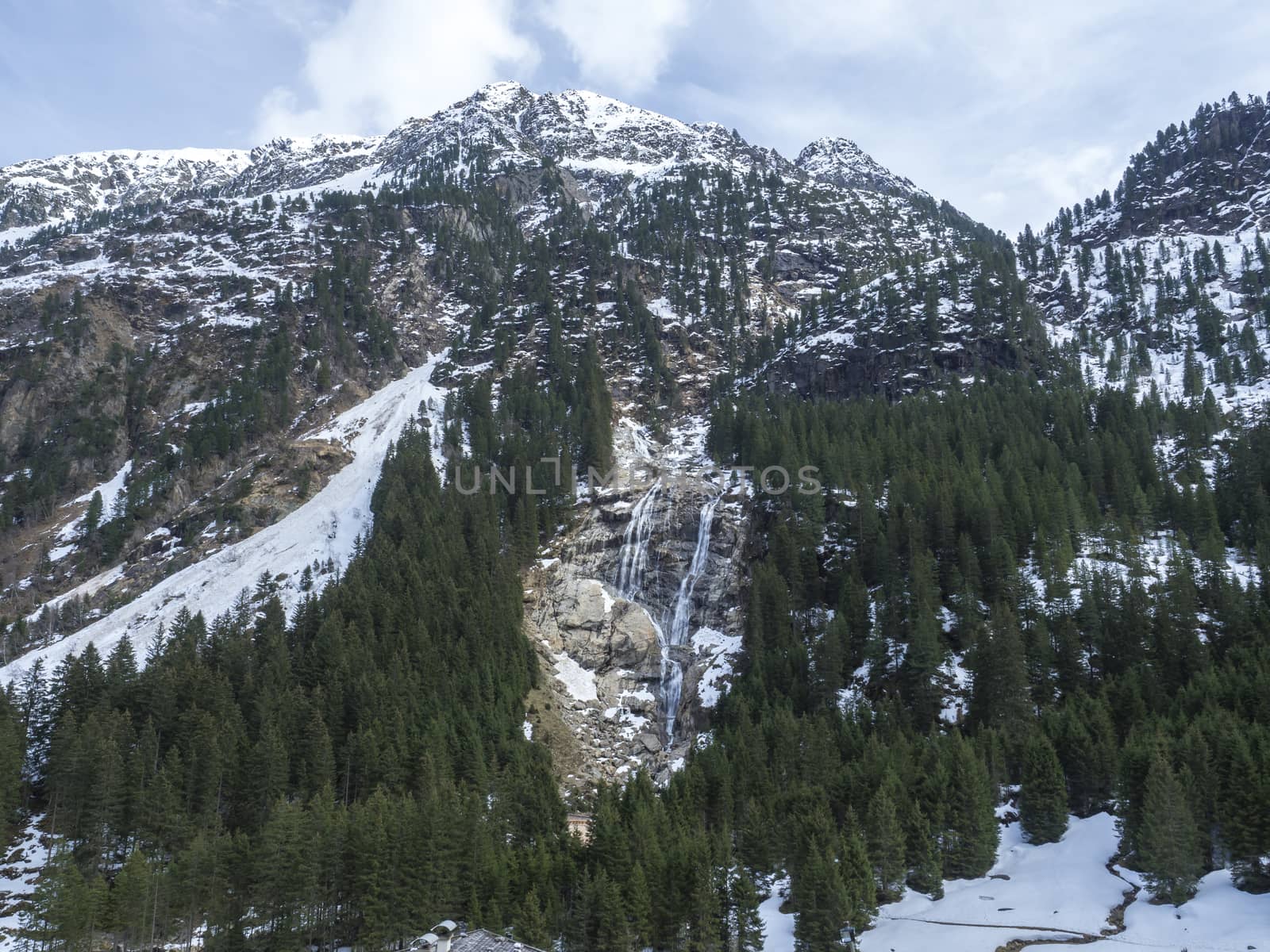 GRAWA Wasserfall Glacier Waterfall situated in Stubai Valley, Tyrol, Austria. Spring mountain river and trees landscape natural environment. Hiking in the alps. by Henkeova