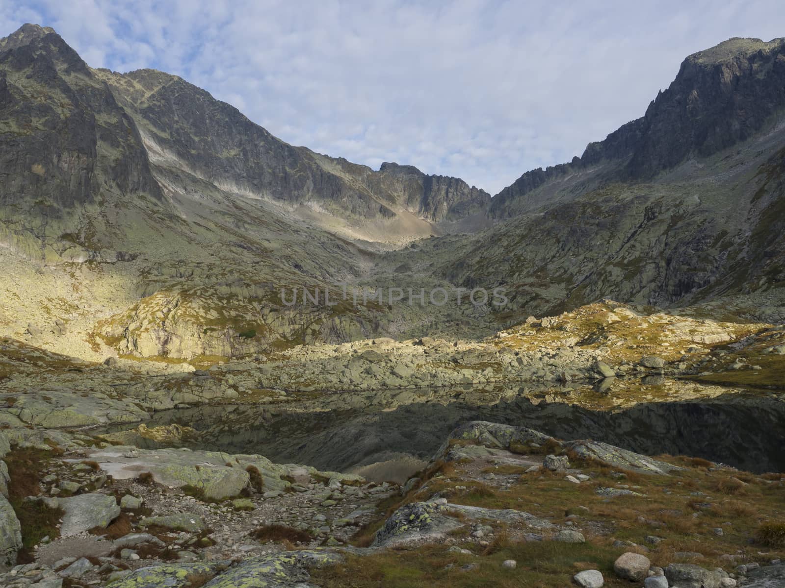 view on mountain lake Prostredne Spisske pleso at the end of the hiking route to the Teryho Chata mountain shelter in the High Tatras in Slovakia.