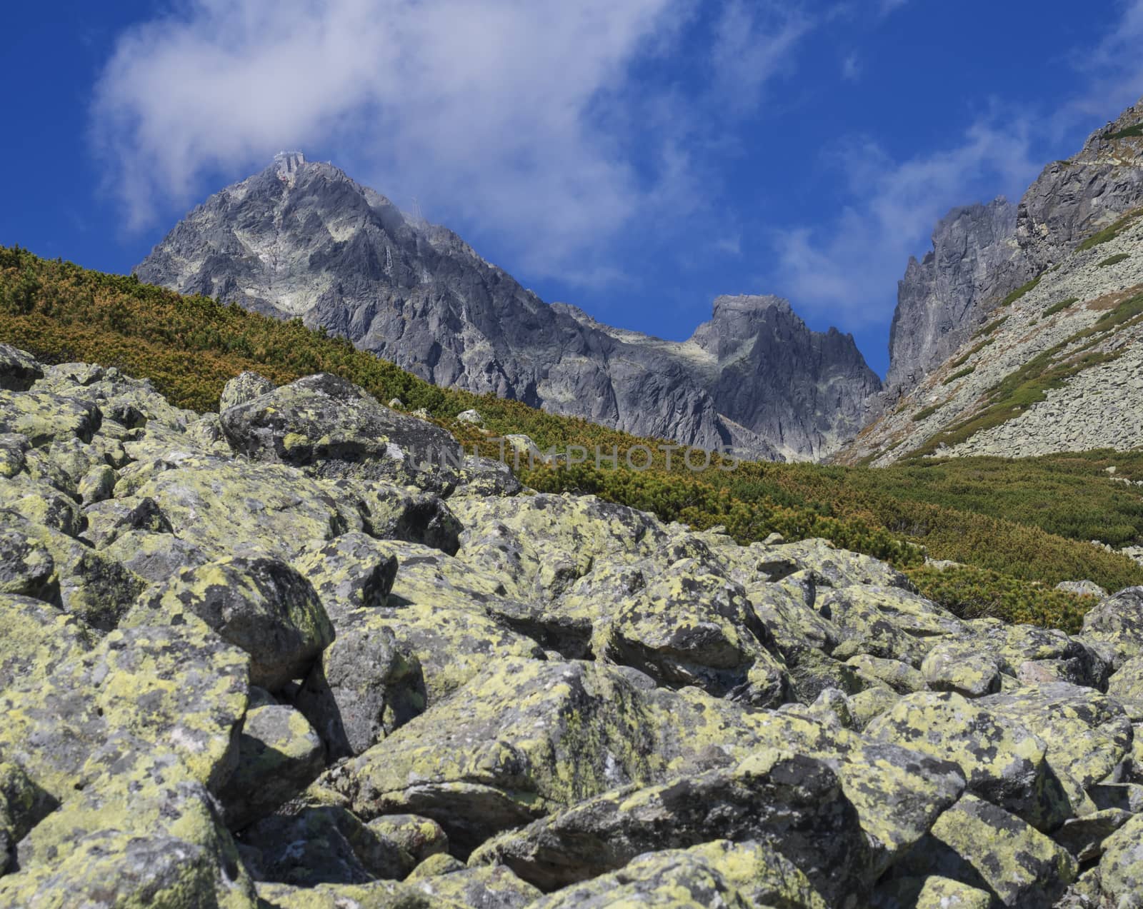 View on mountain Peak Lomnicky stit 2 634 m covered in clouds at Summer, one of the highest mountain peaks in the High Tatras mountains of Slovakia Vysoke Tatry.