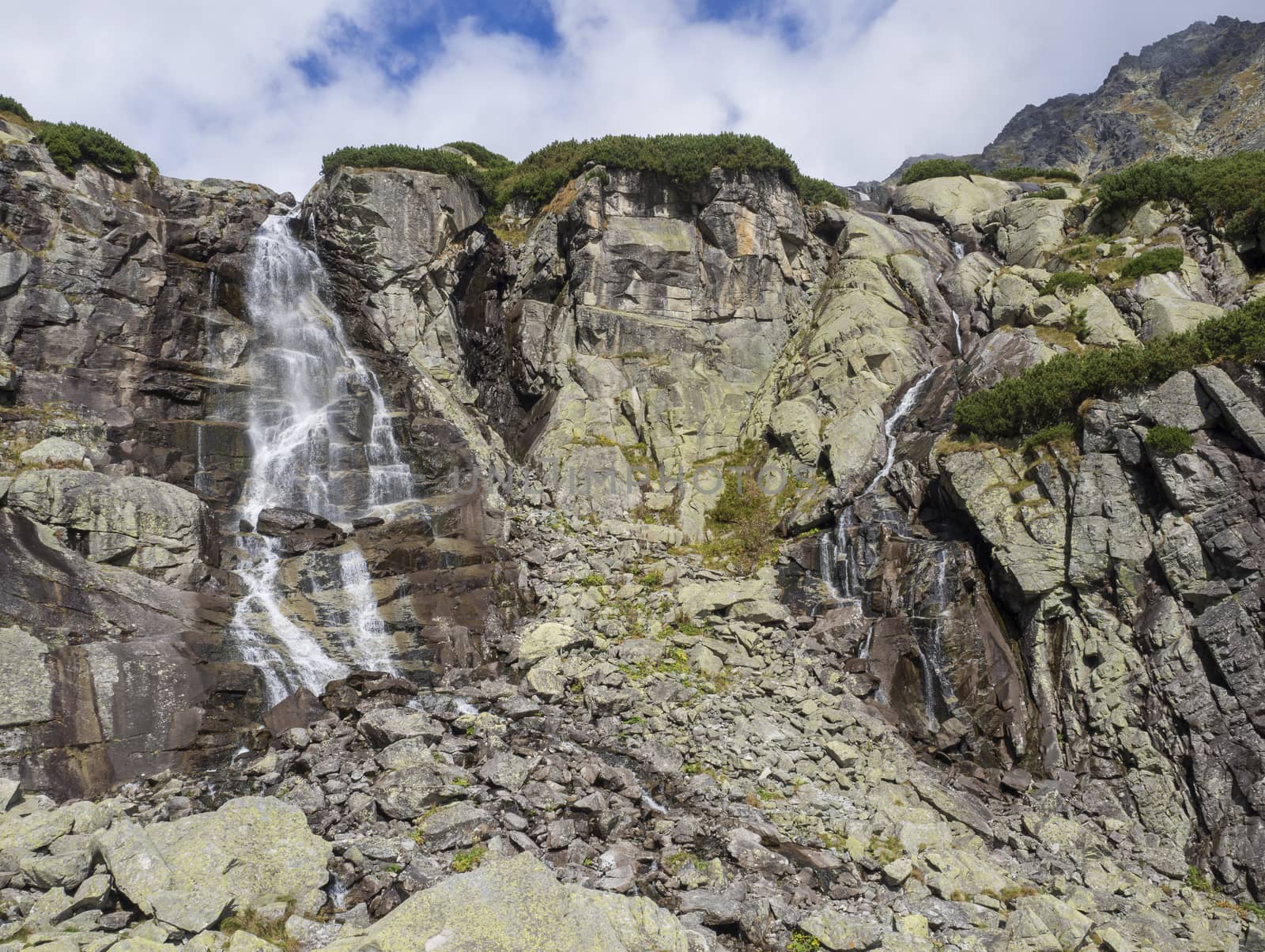 Skok waterfall High Tatras mountain, summer sunny day, Strbske Pleso, Slovakia.