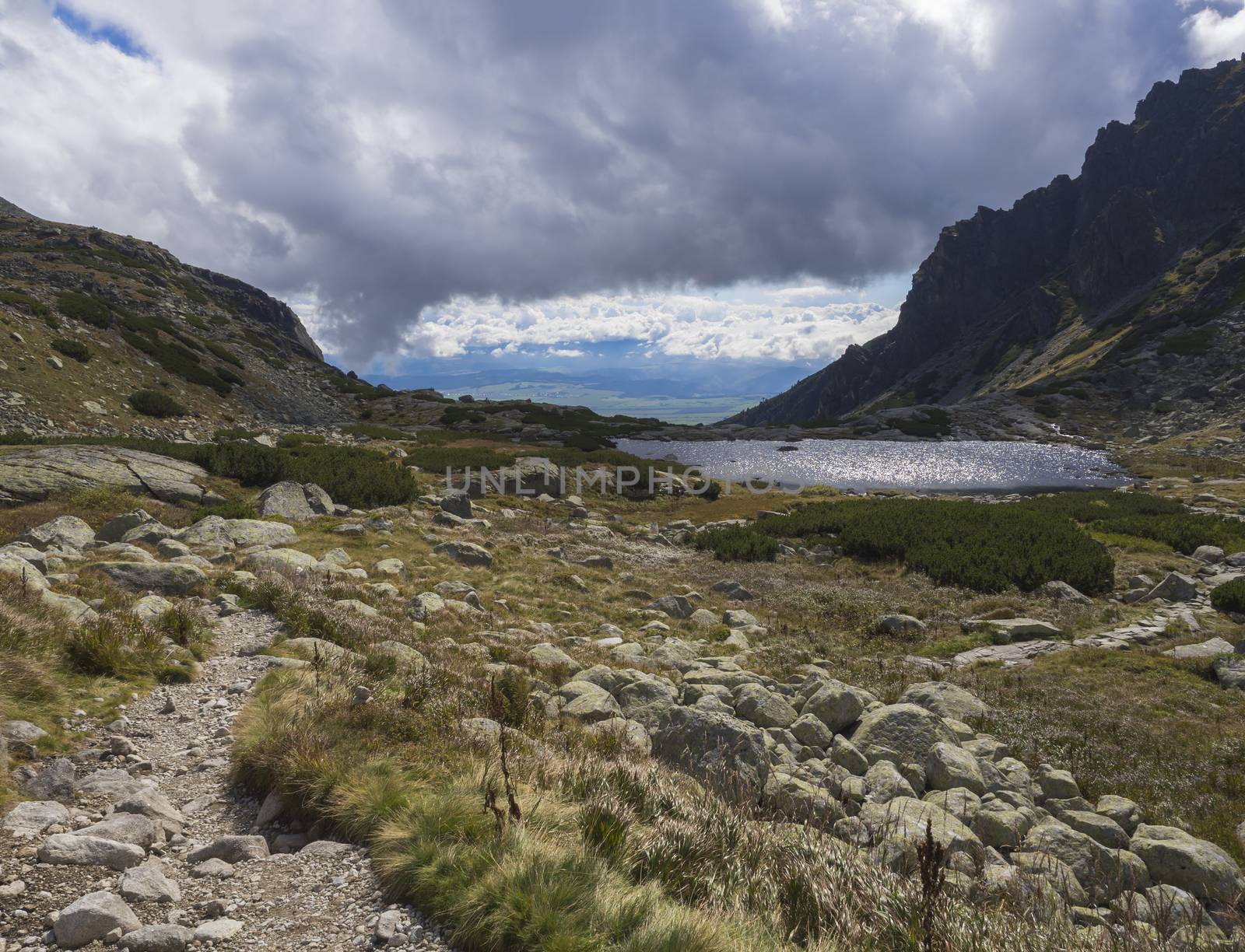 Pleso nad Skokom, beautiful mountain lake in Mlynicka Dolina Valley with footpath trail in High Tatras mountain, Vysoke Tatry , Slovakia.