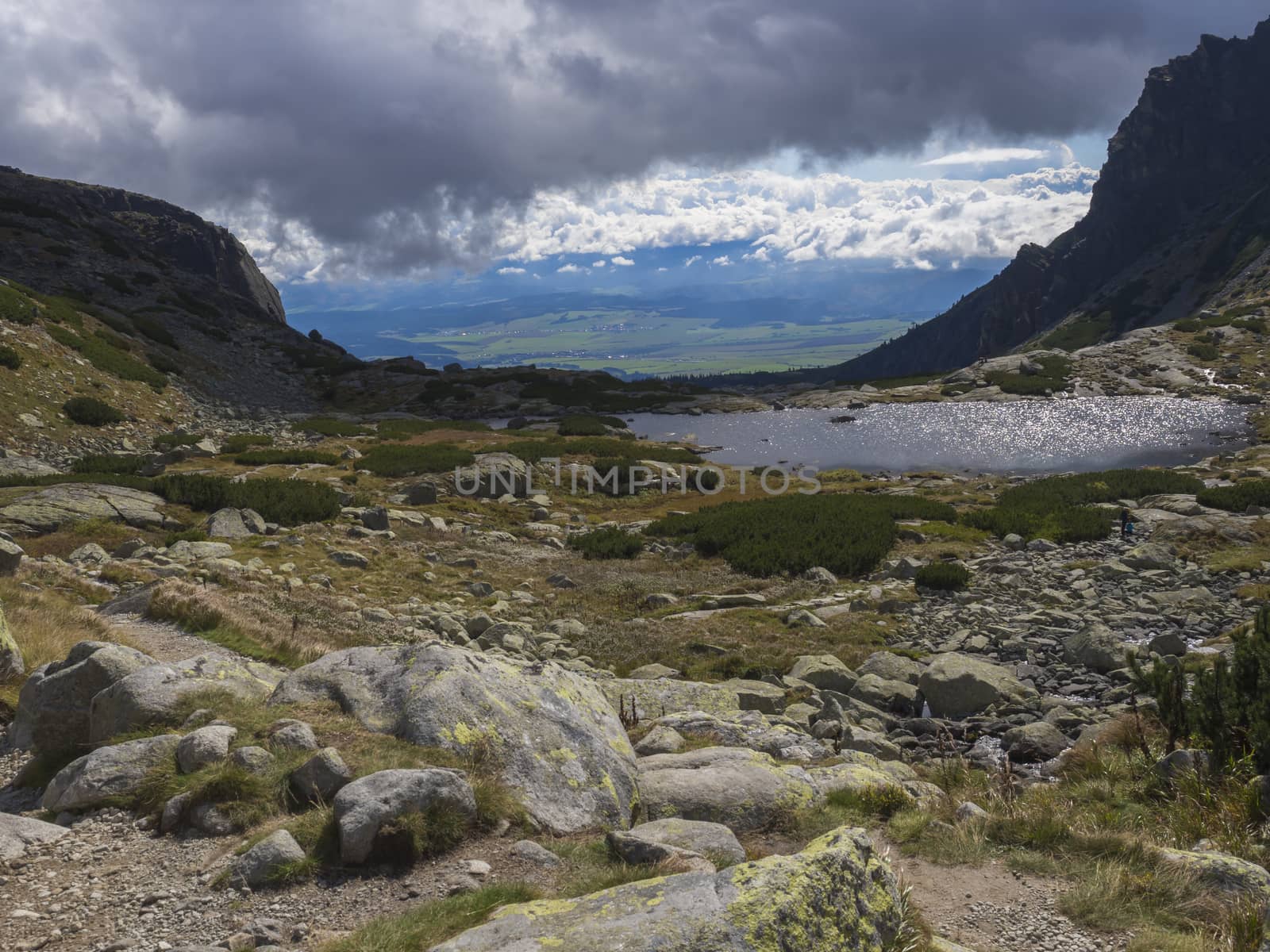 Valley Mlynska Dolina in slovakia mountains with view on Strbske pleso village and mountain lake Pleso Nad Skokom, High Tatra Mountains, Slovakia, summer day