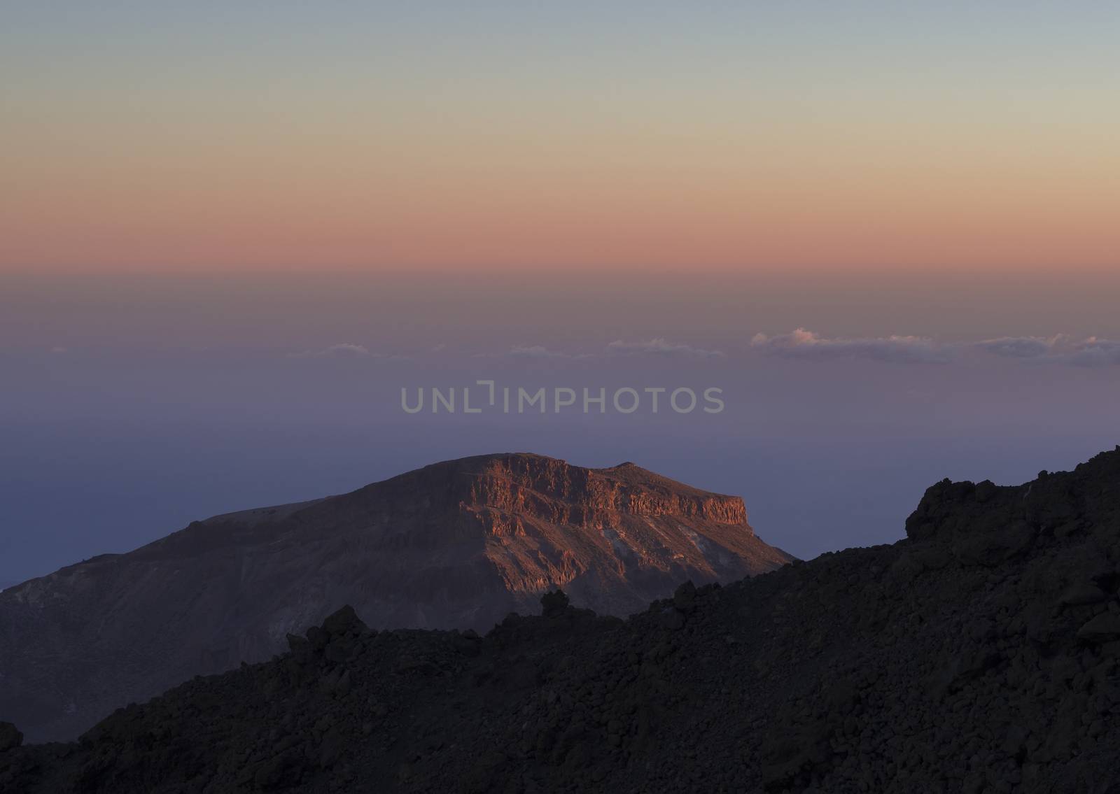 pink colorful sunset with view on red mountain in tenerife national el teide park