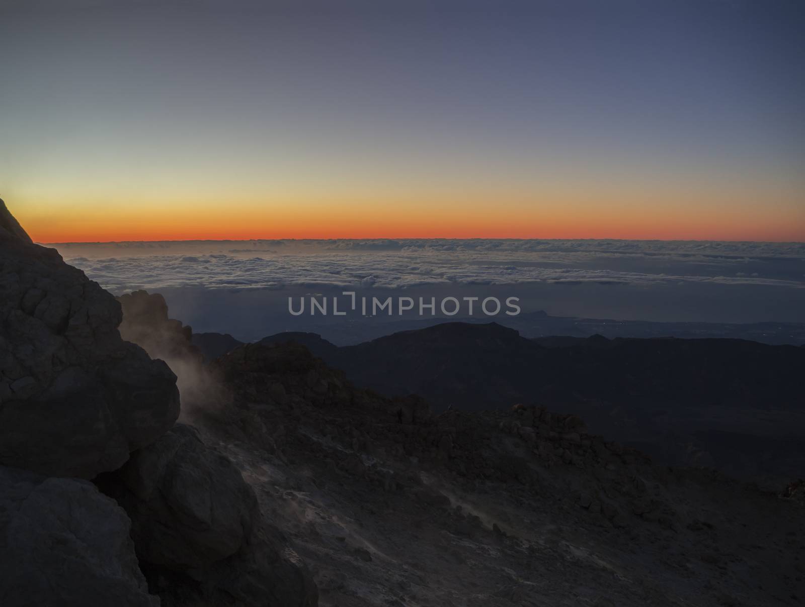 red glow before sunrise on the top of pico del teide  vulcano highest spanish mountain on tenerife canary island