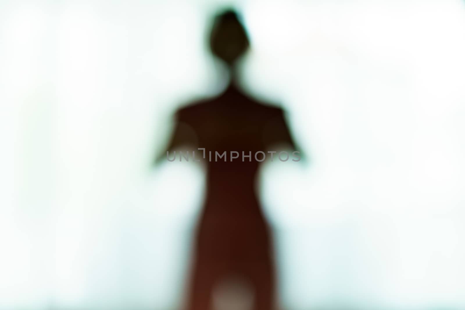 Blurred silhouette of human body look like alien. by sirawit99