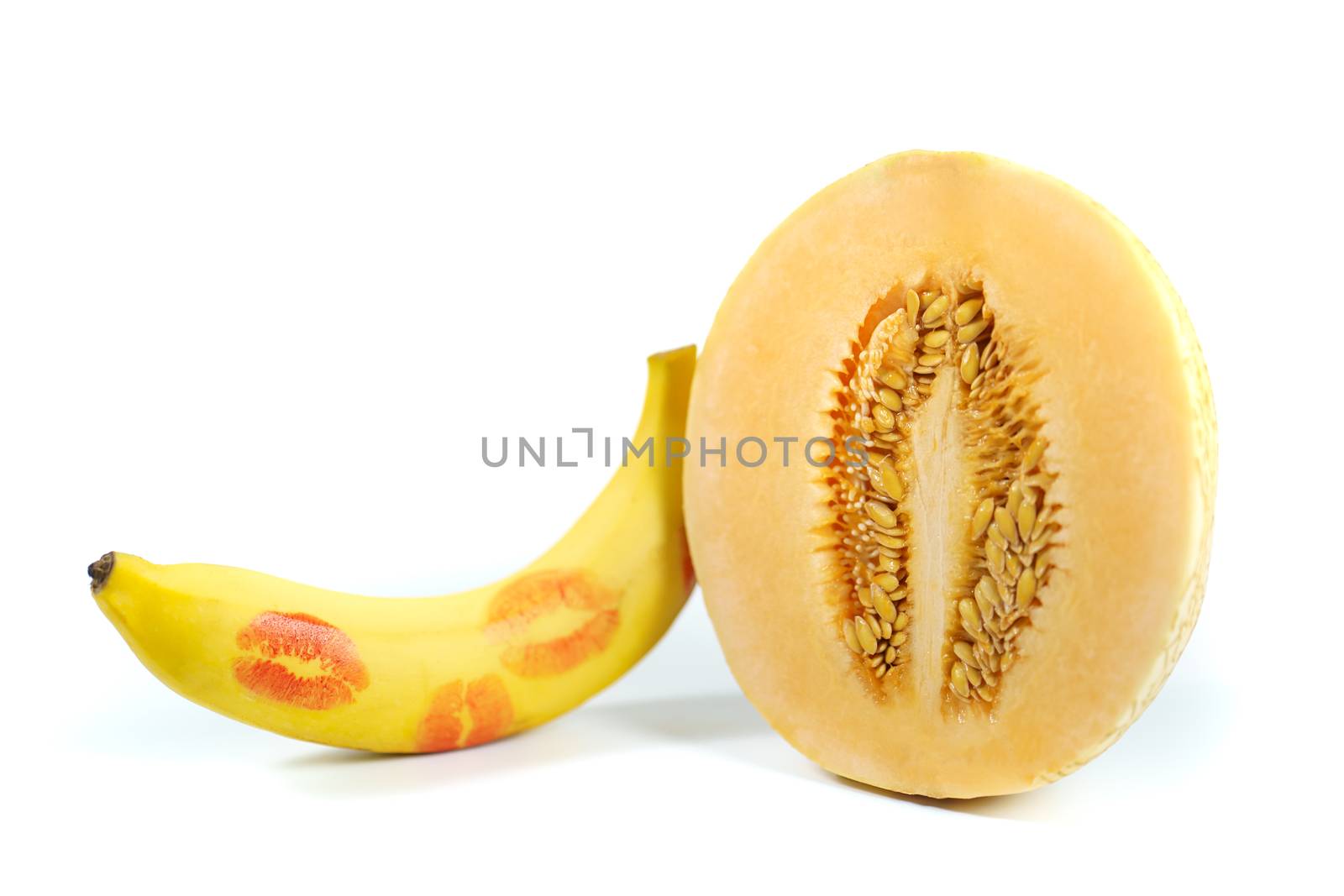 Melon and banana with red lipstick marks on white background, Sex concept. isolated