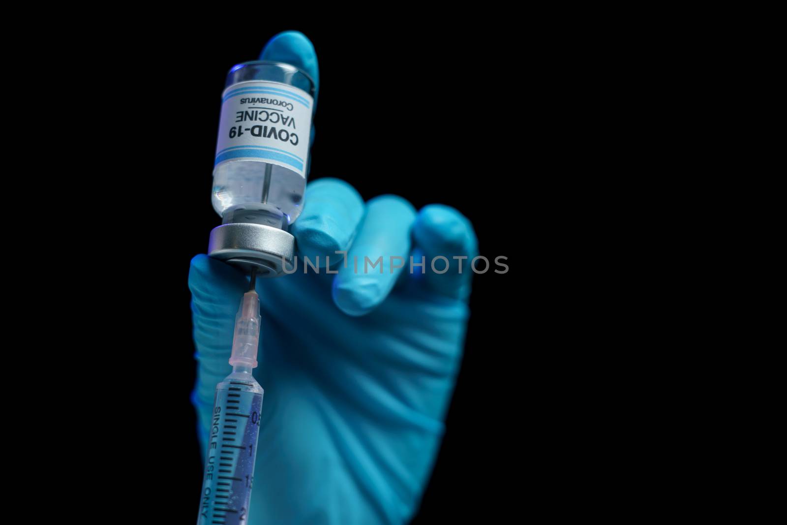 Hand in blue glove holding vaccine and syringe injection for pre by sirawit99