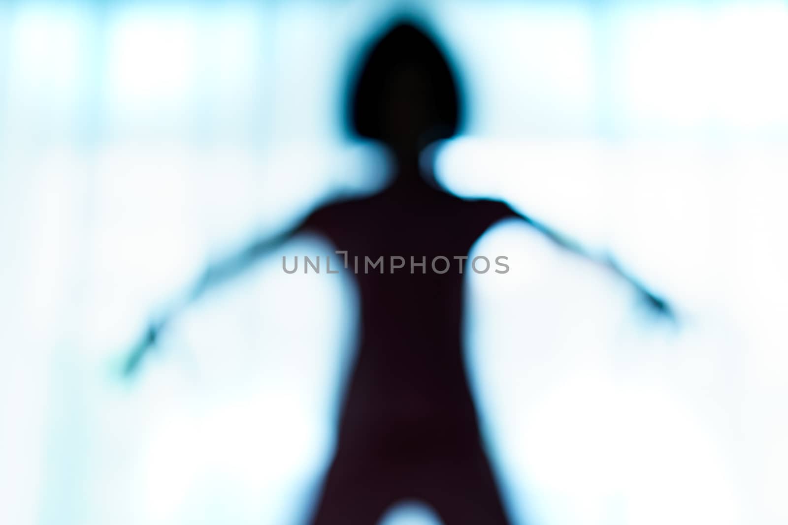 Blurred silhouette of human body look like alien. by sirawit99