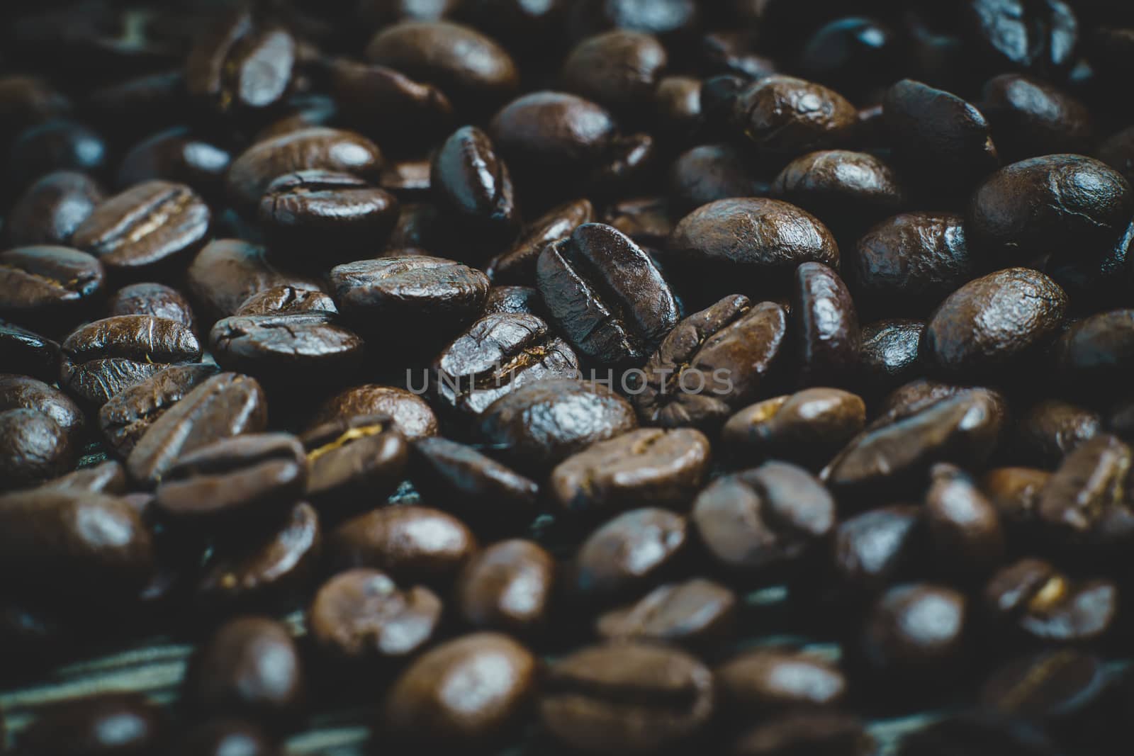 Coffee beans. On a wooden background. by sirawit99