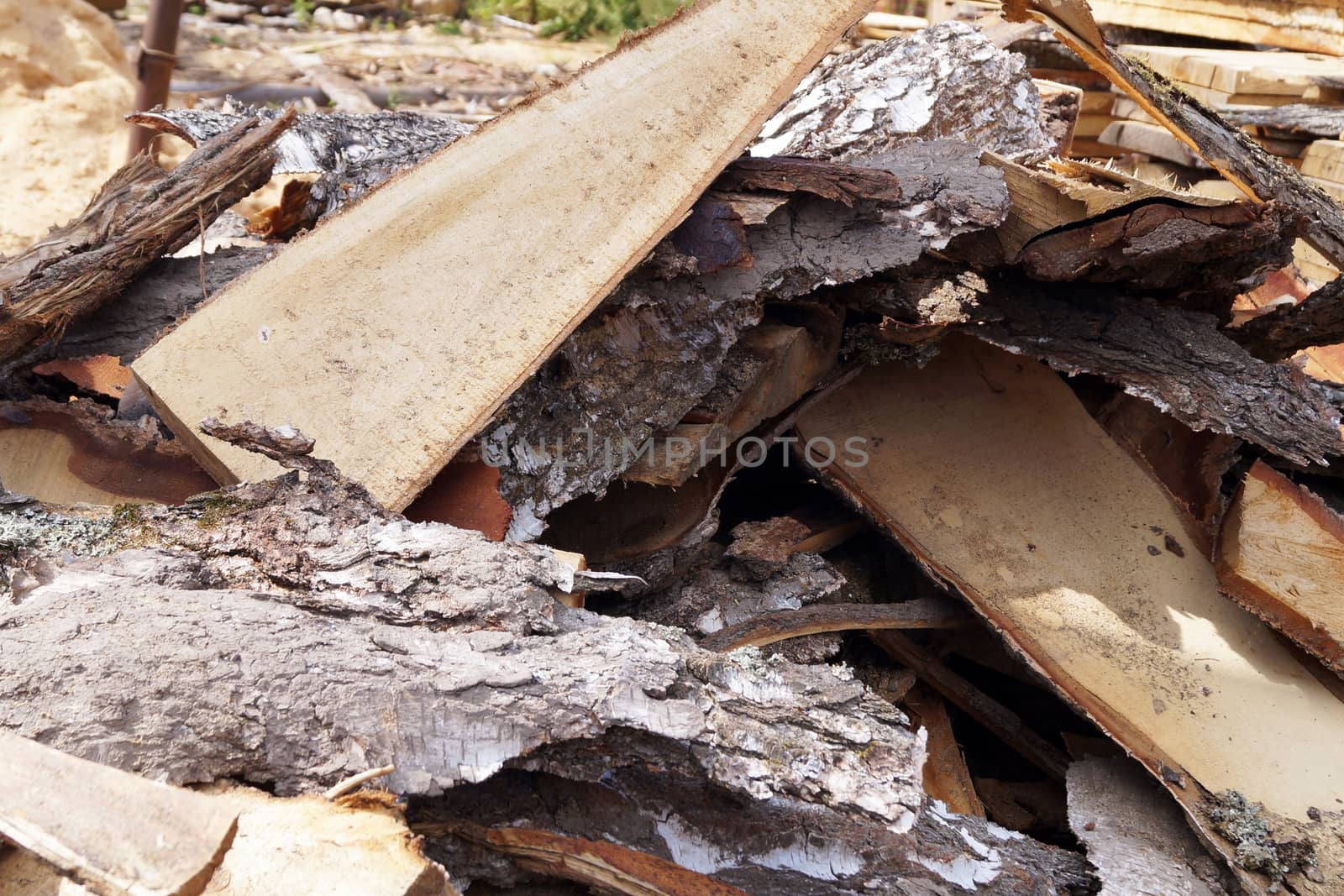 waste from wood production, bark trimming in the open air by Annado