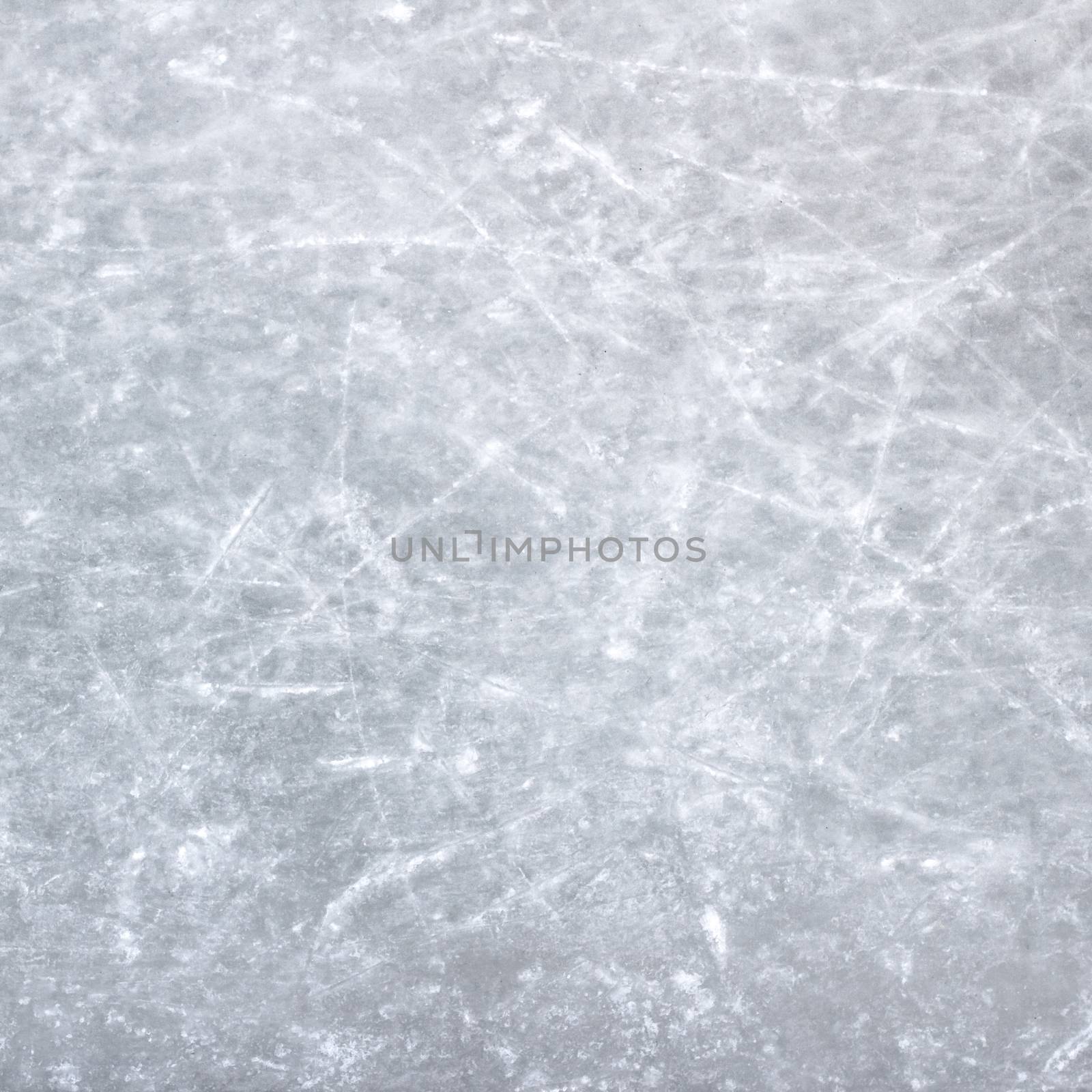 Scratches on a skating rink on ice.